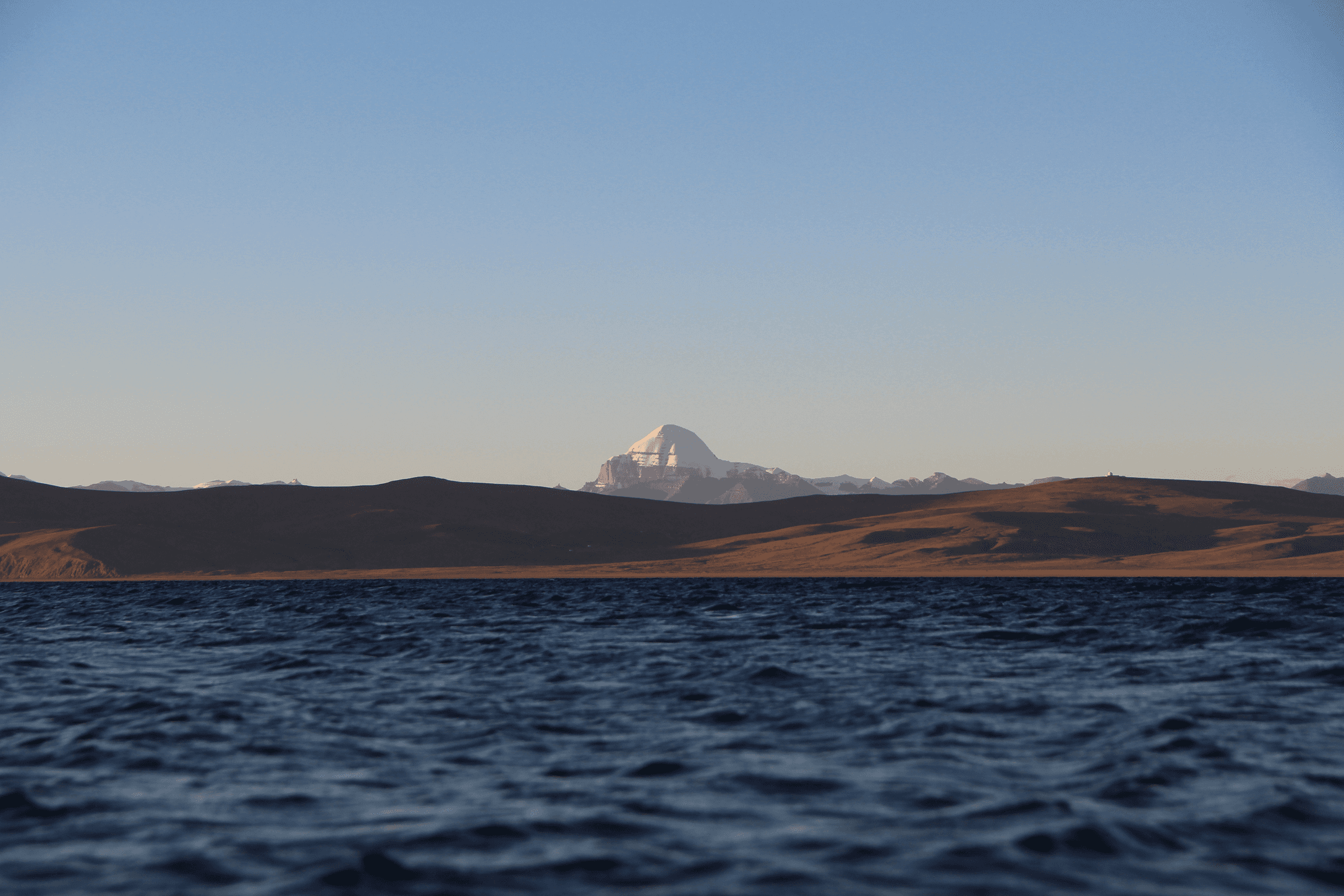 a snowy mountain range with stars in the sky
