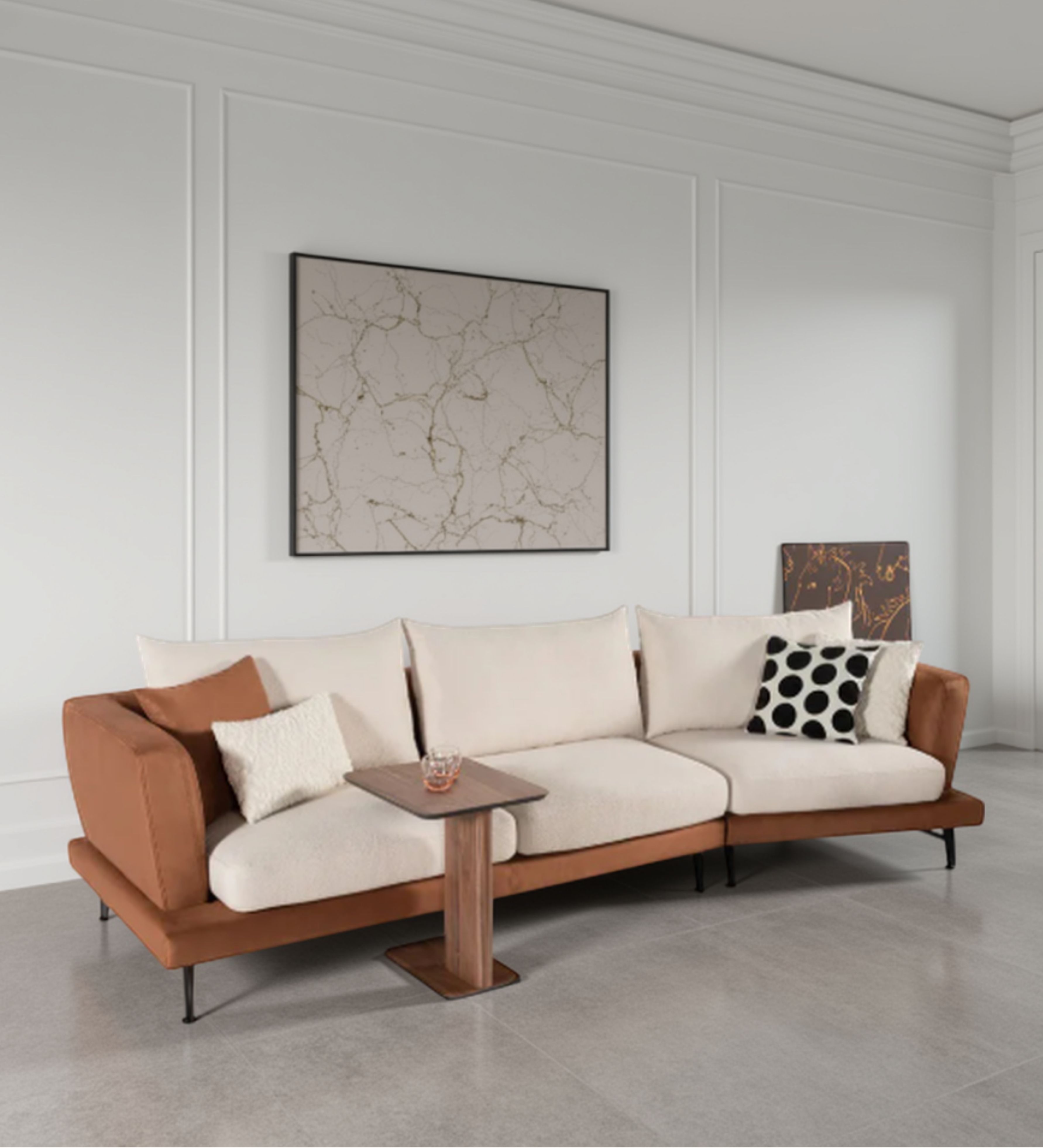 Neutral fabric seating with tan upholstered arms and slim metal legs