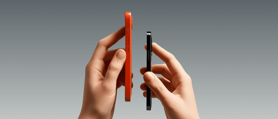 Two hands holding red and black smartphones for a thickness comparison