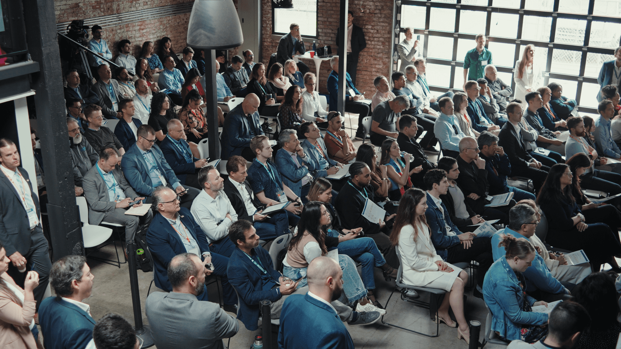 People watching a presentation at an event in Tulsa.