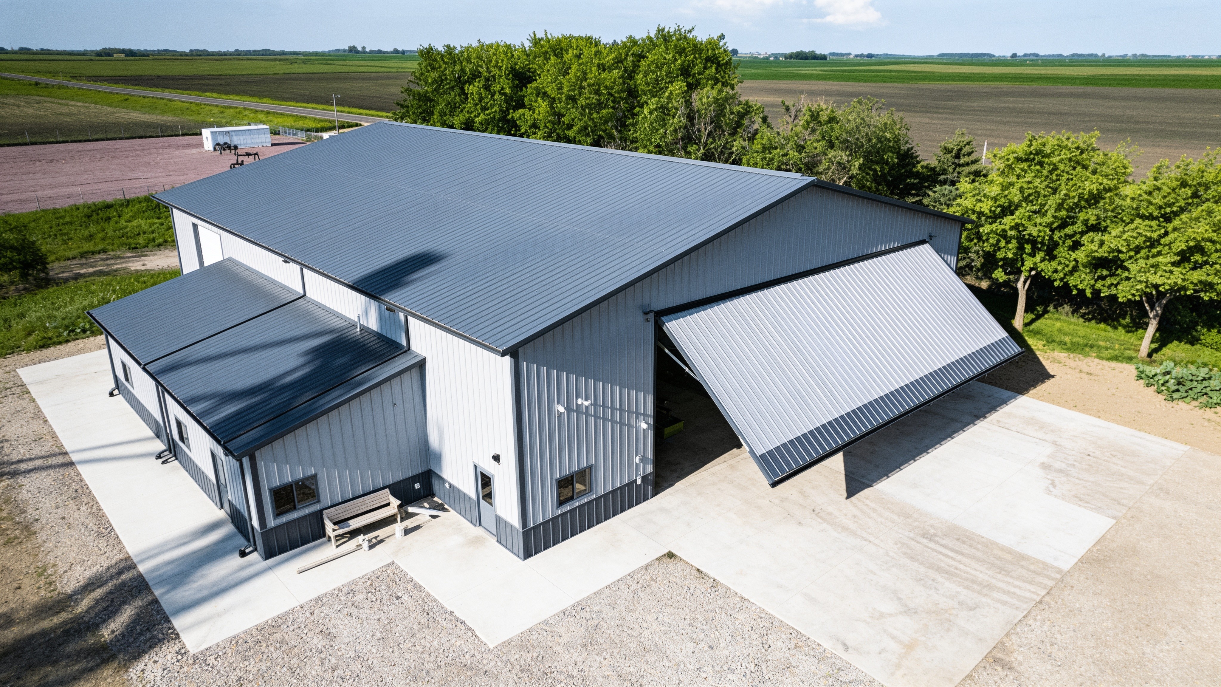 Aerial view of a farm shop with a raised hydraulic agricultural door