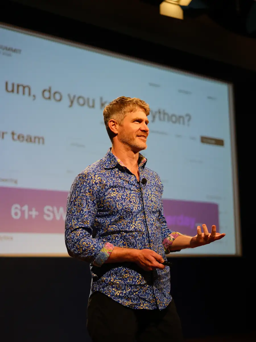 A speaker sharing ideas at a previous Summit event