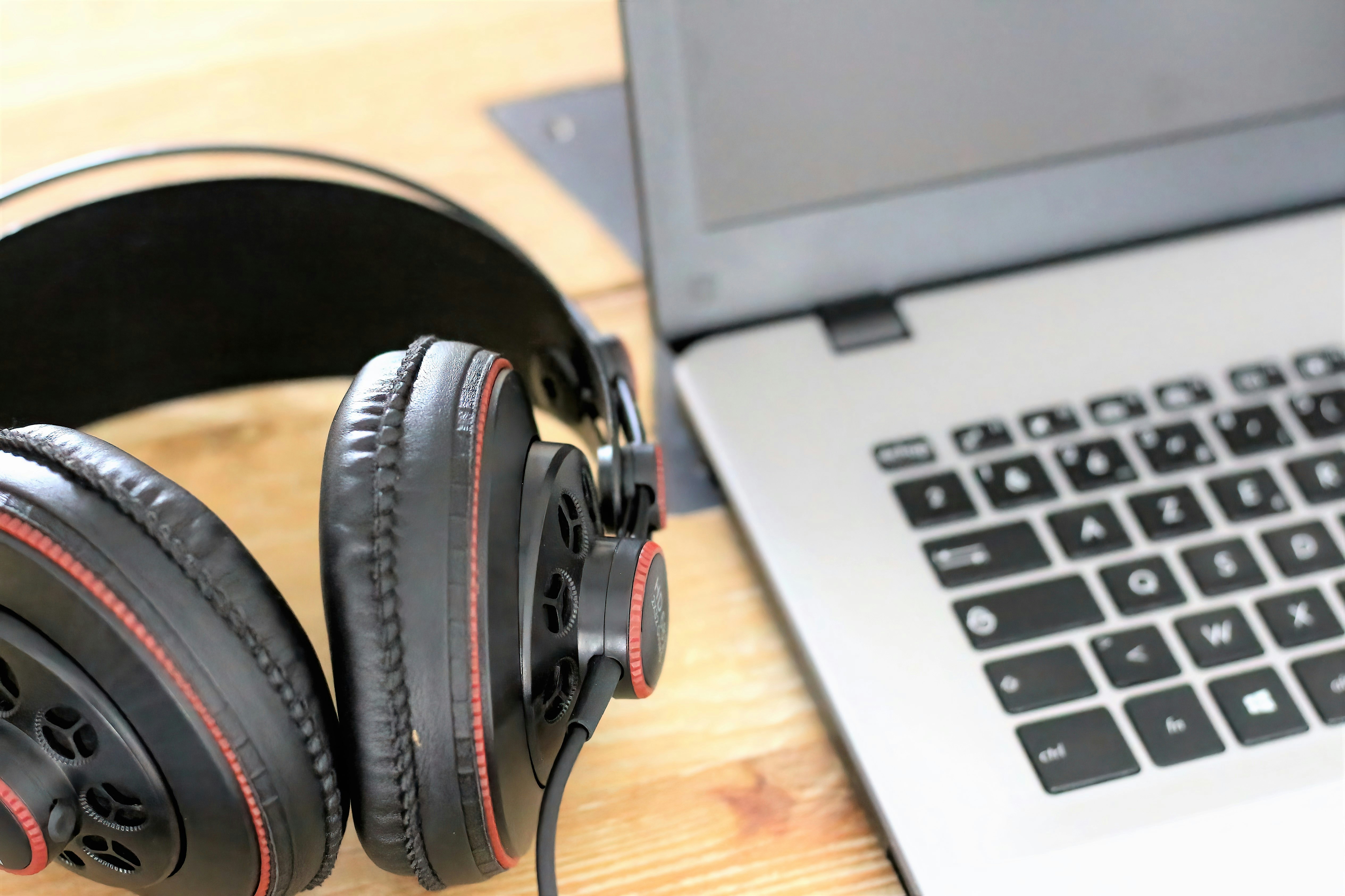 headphones near a laptop - Free Music Promotion