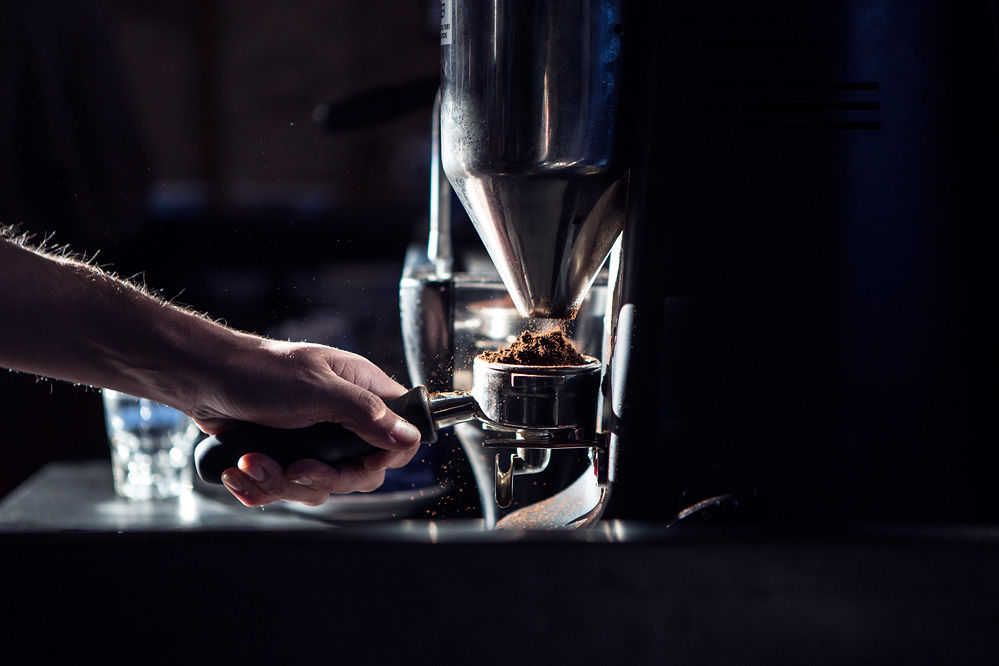 Woman with red hair covering mouth with hair