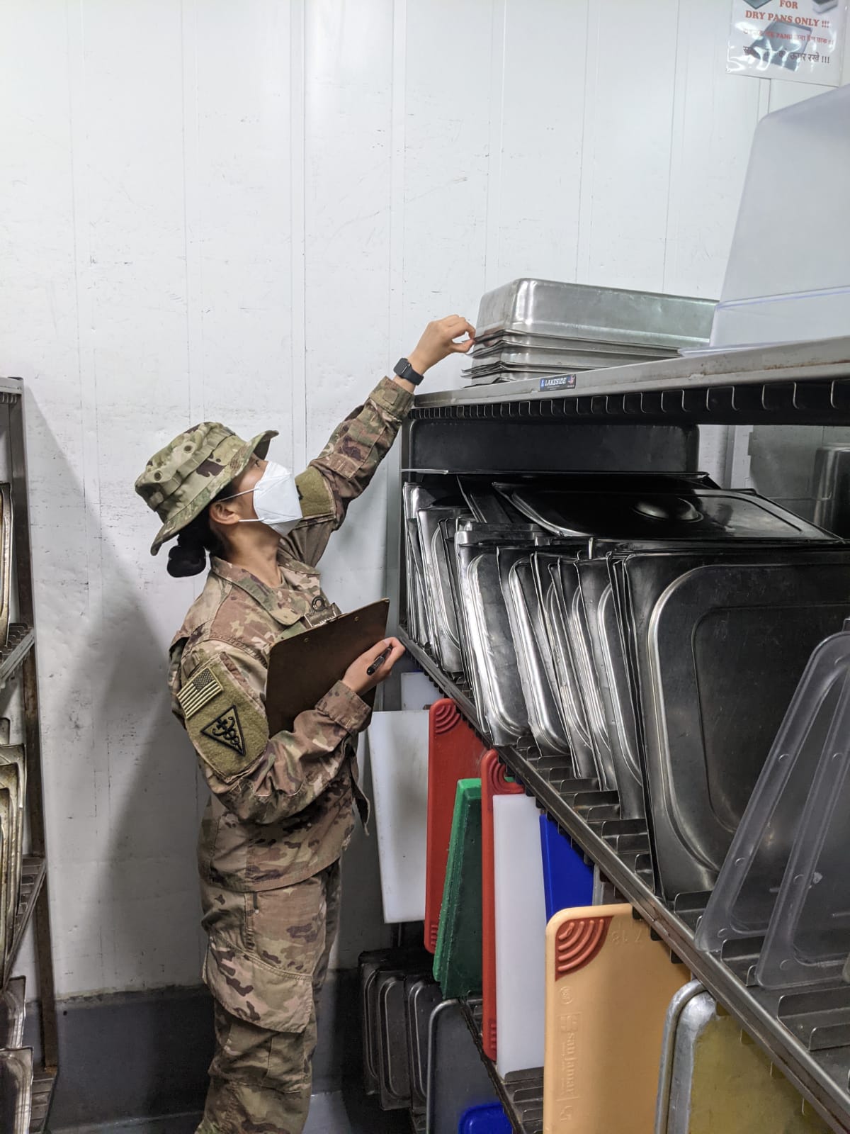 soldier looking through tray rack