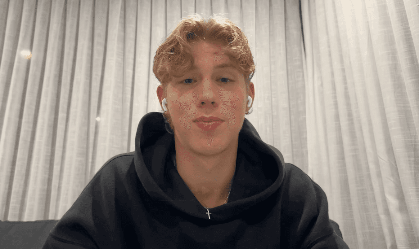 man standing beside wall