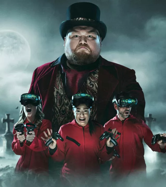 Three players in red jumpsuits looking terrified in VR headsets, overshadowed by a large spooky ringmaster and ghostly figures in a horror setting.