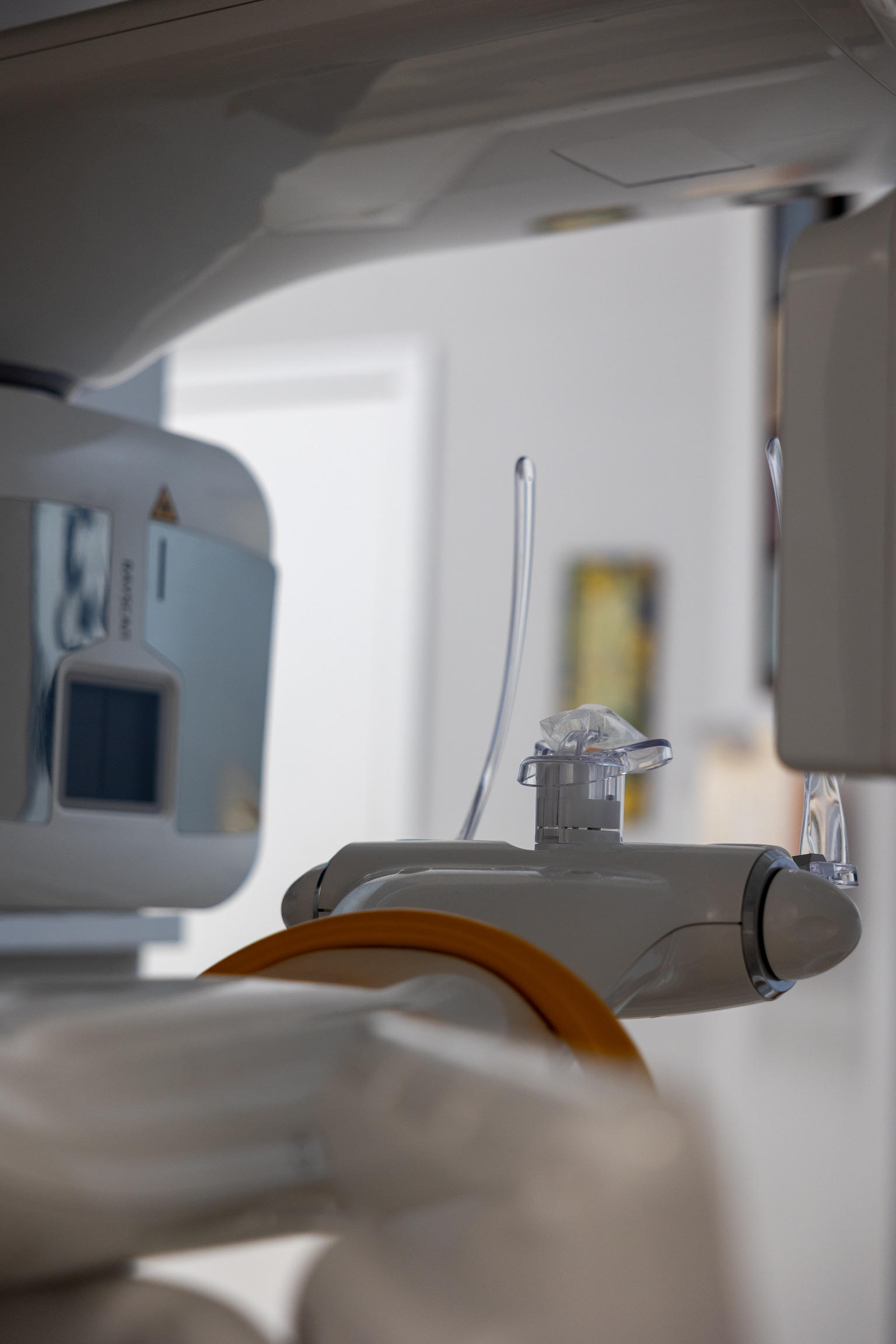 Dentist preparing teeth for veneer application in a modern dental office