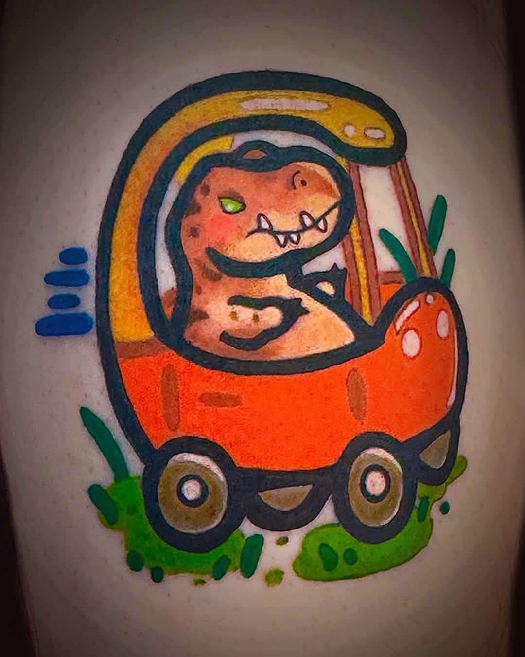 full color tattoo of a t-rex dinosaur in a kids car very cute style by Deirdre Aikin