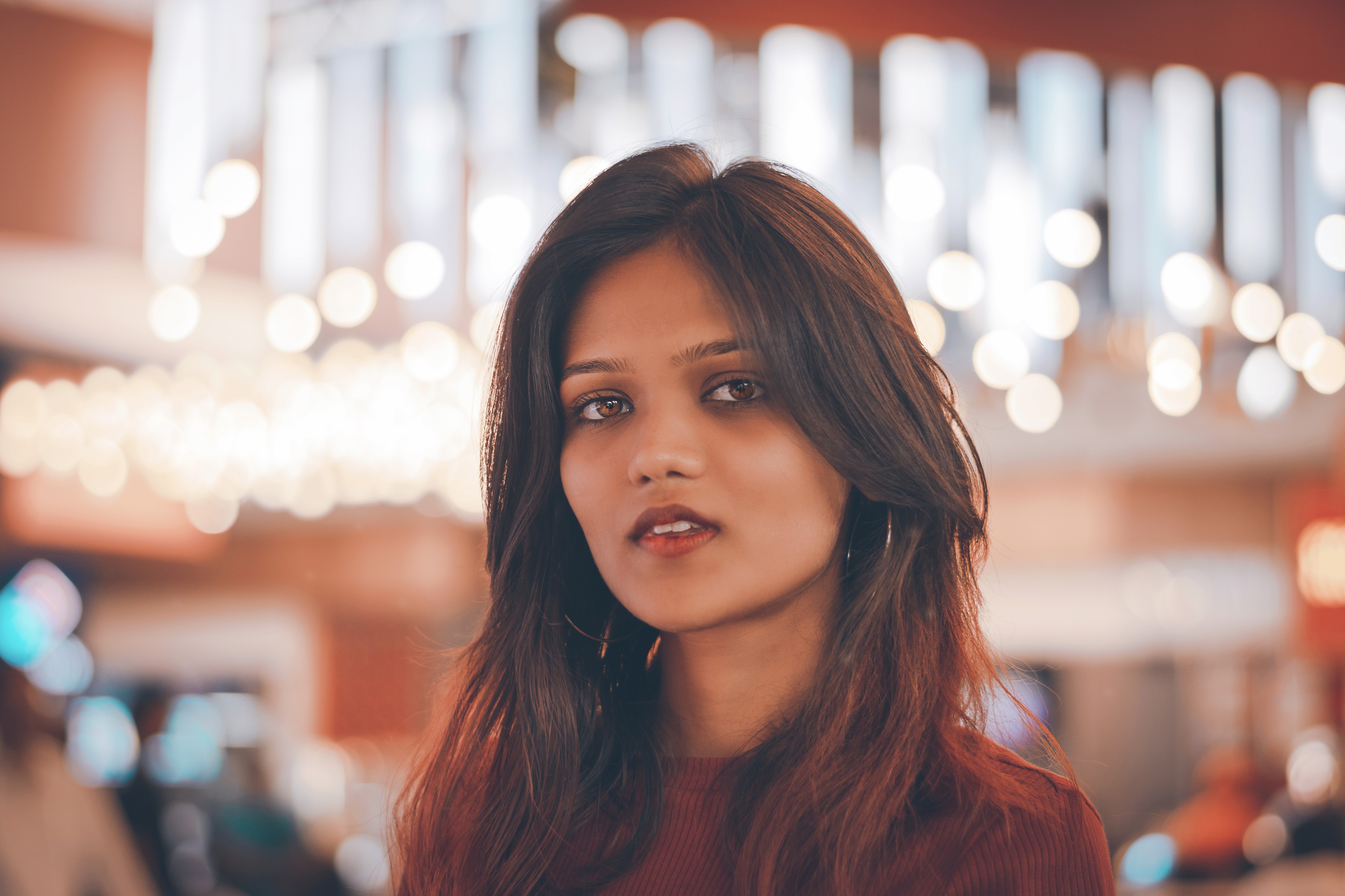 a woman holding a red flower