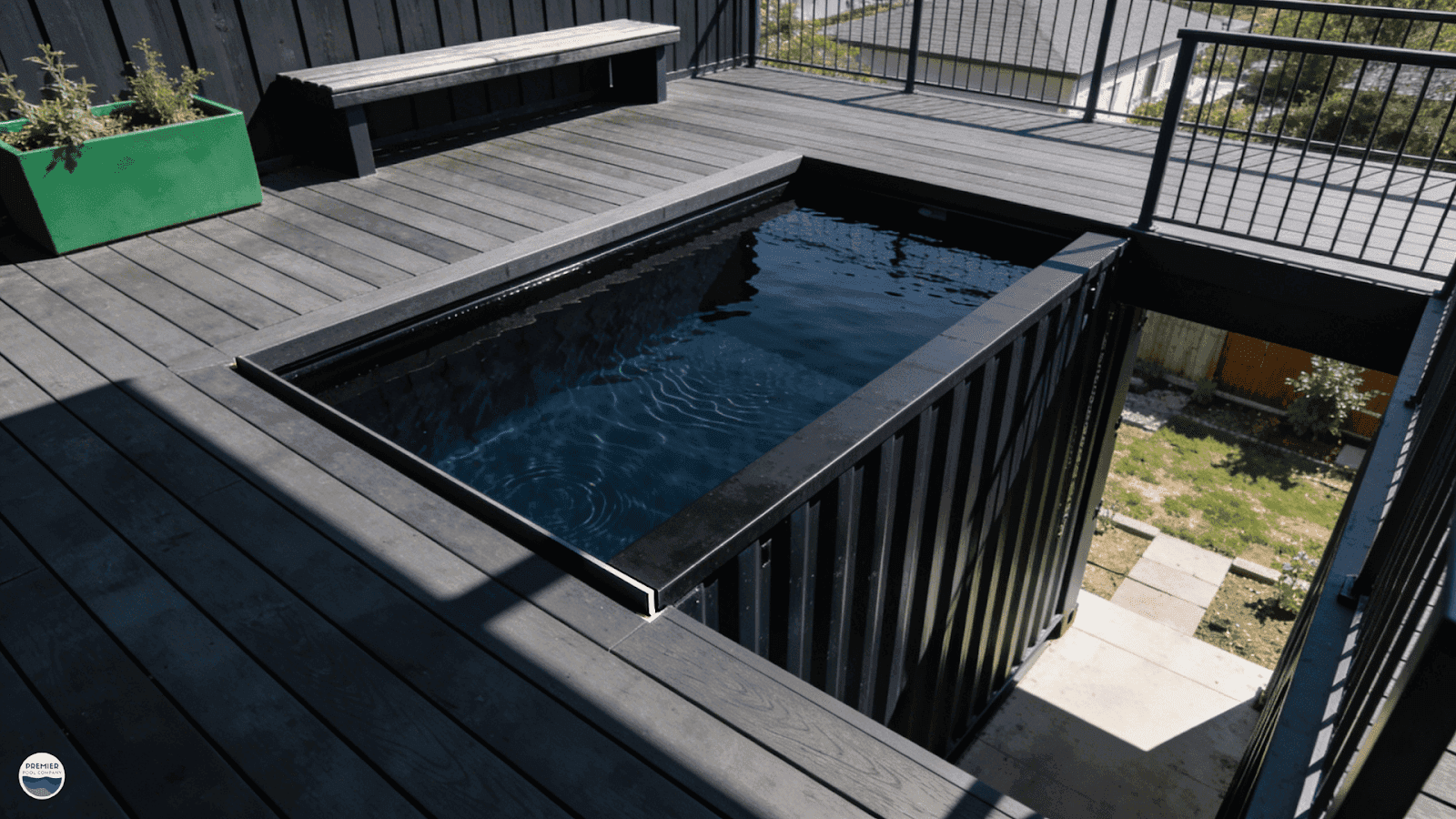 Elevated container pool with infinity look edge and composite decking