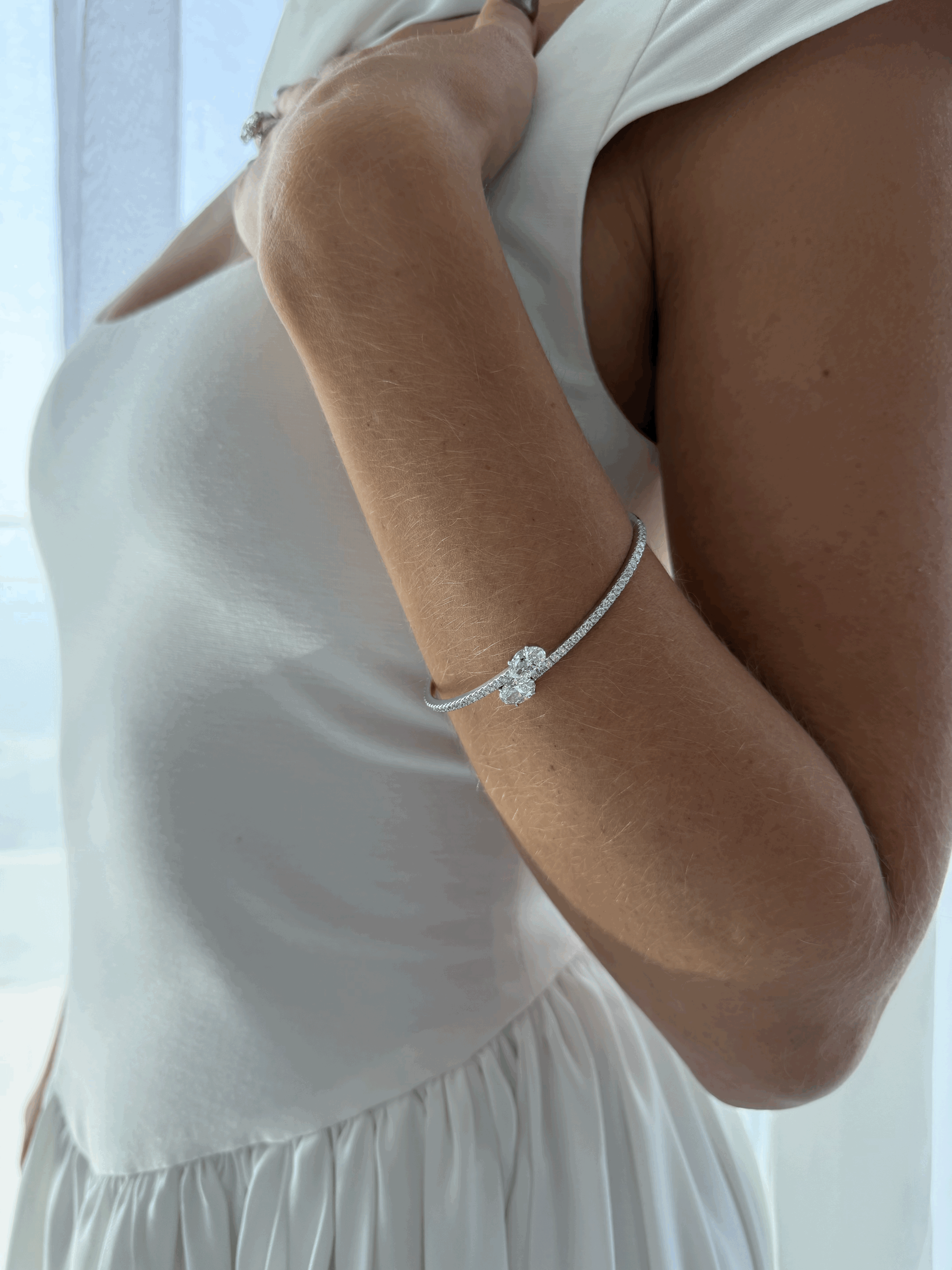 person wearing gold and diamond ring