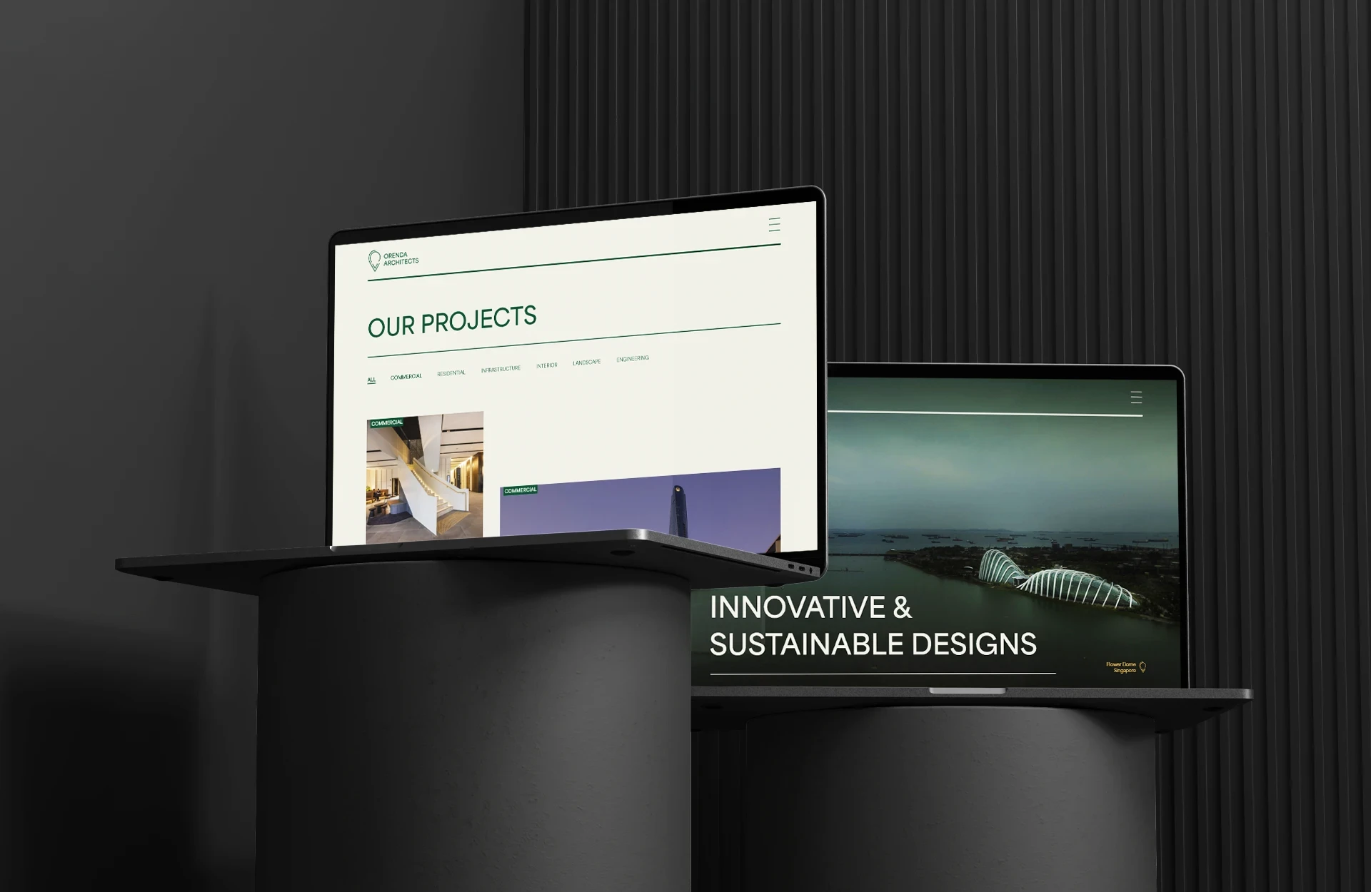 Laptops on dark pdiums mockup with Orenda Architects website