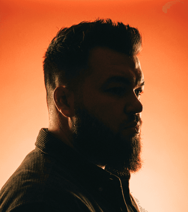 a blurry photo of a person standing in front of a wall