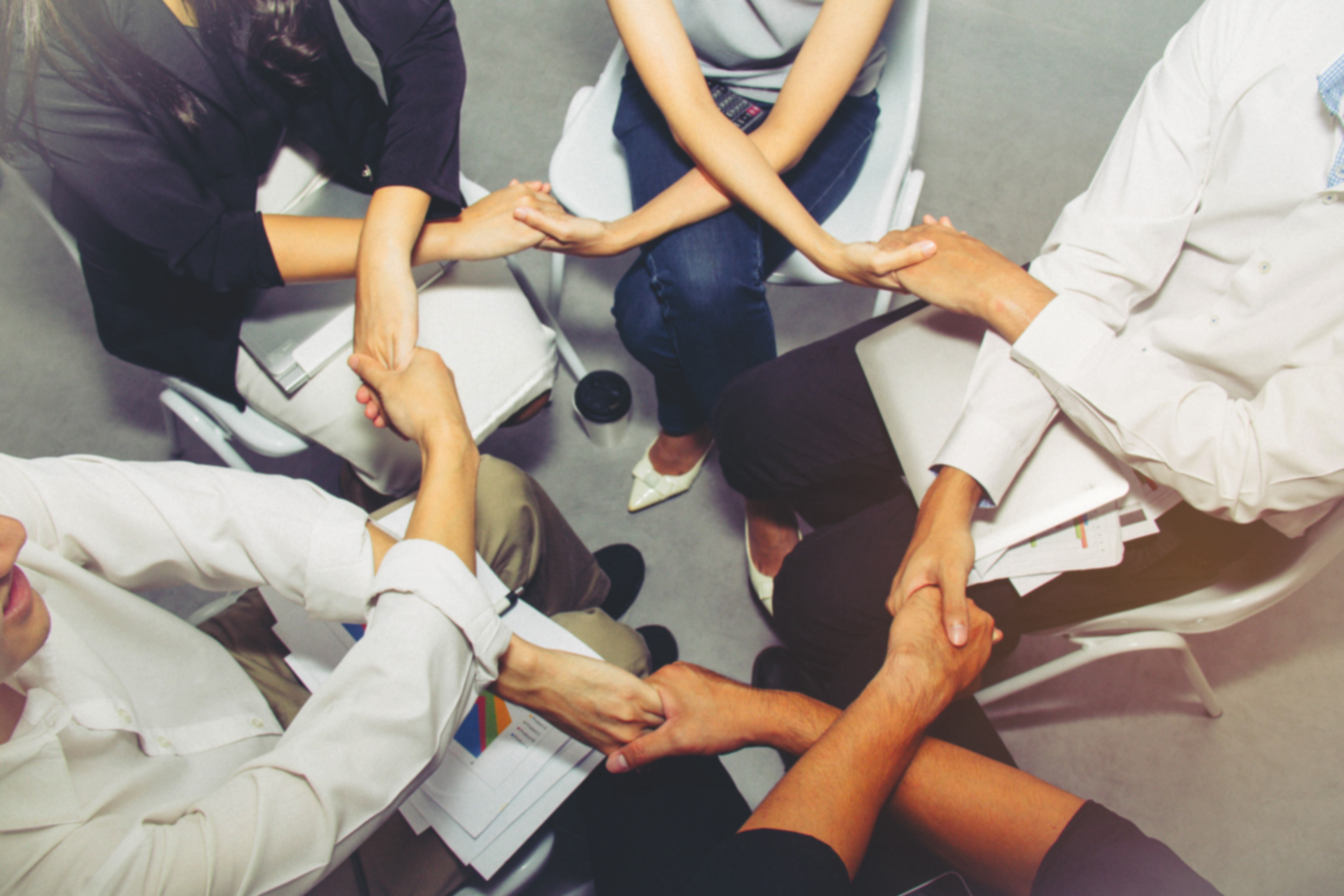 person sitting in a chair in front of a man