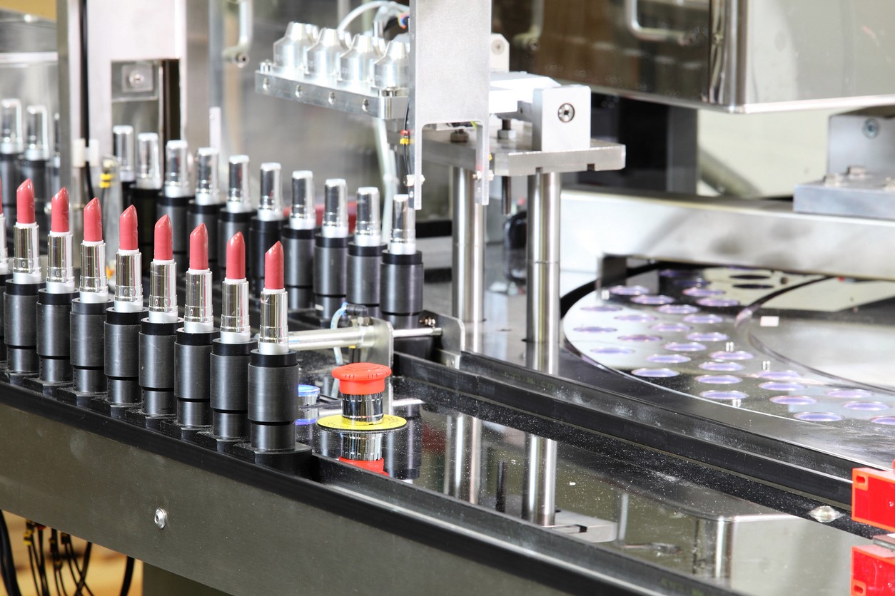 Assembly line showing tubes of lipstick