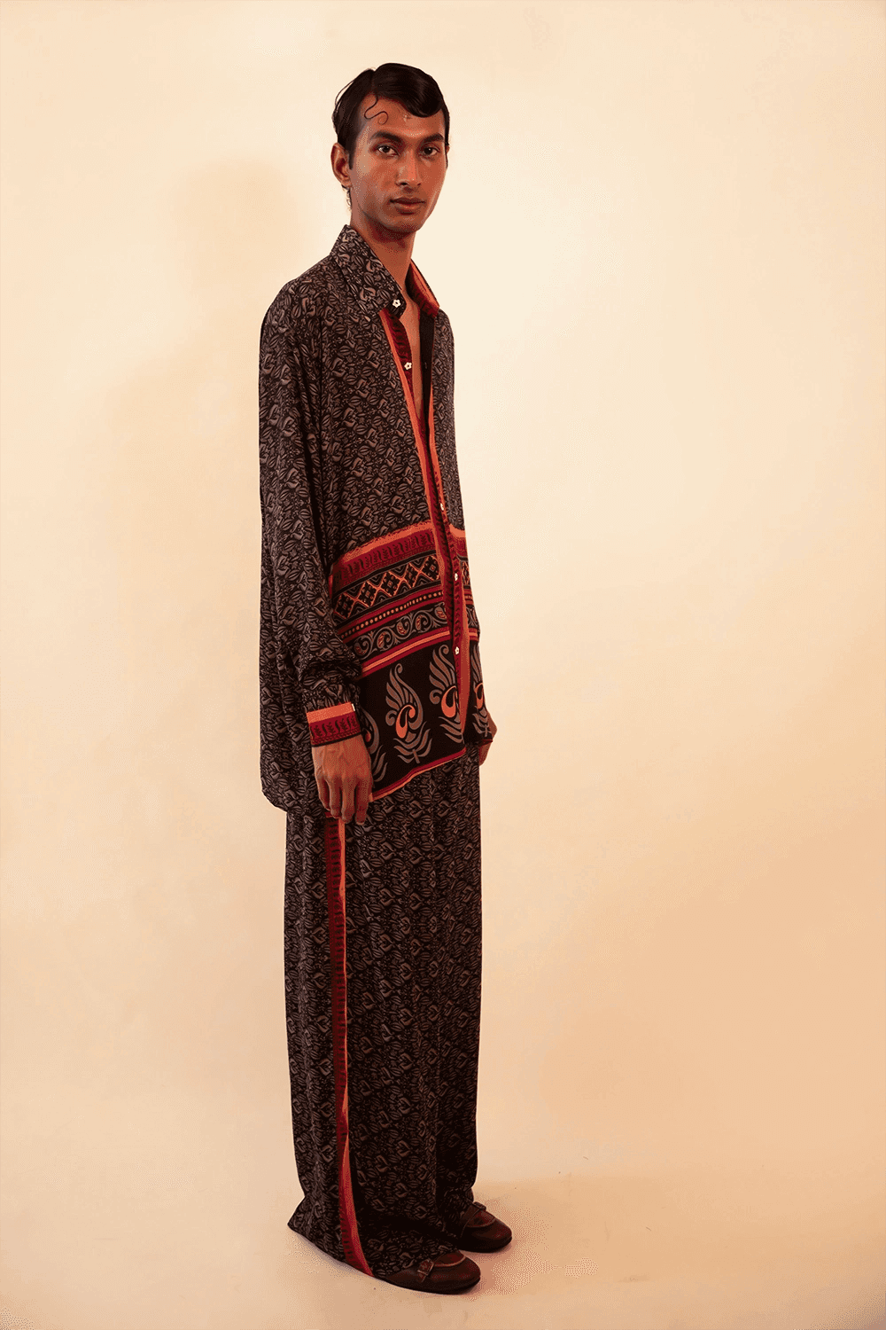 Lavya is our one-of-a-kind black and red shirt and pant set, handcrafted by skilled artisans in-house using a one-of-a-kind vintage silk saree. 