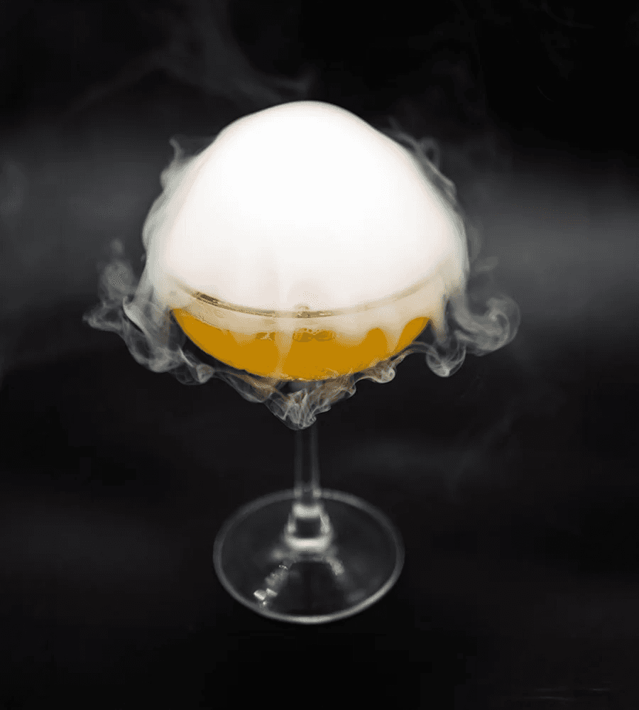 A chef placing fried chicken in a take away box