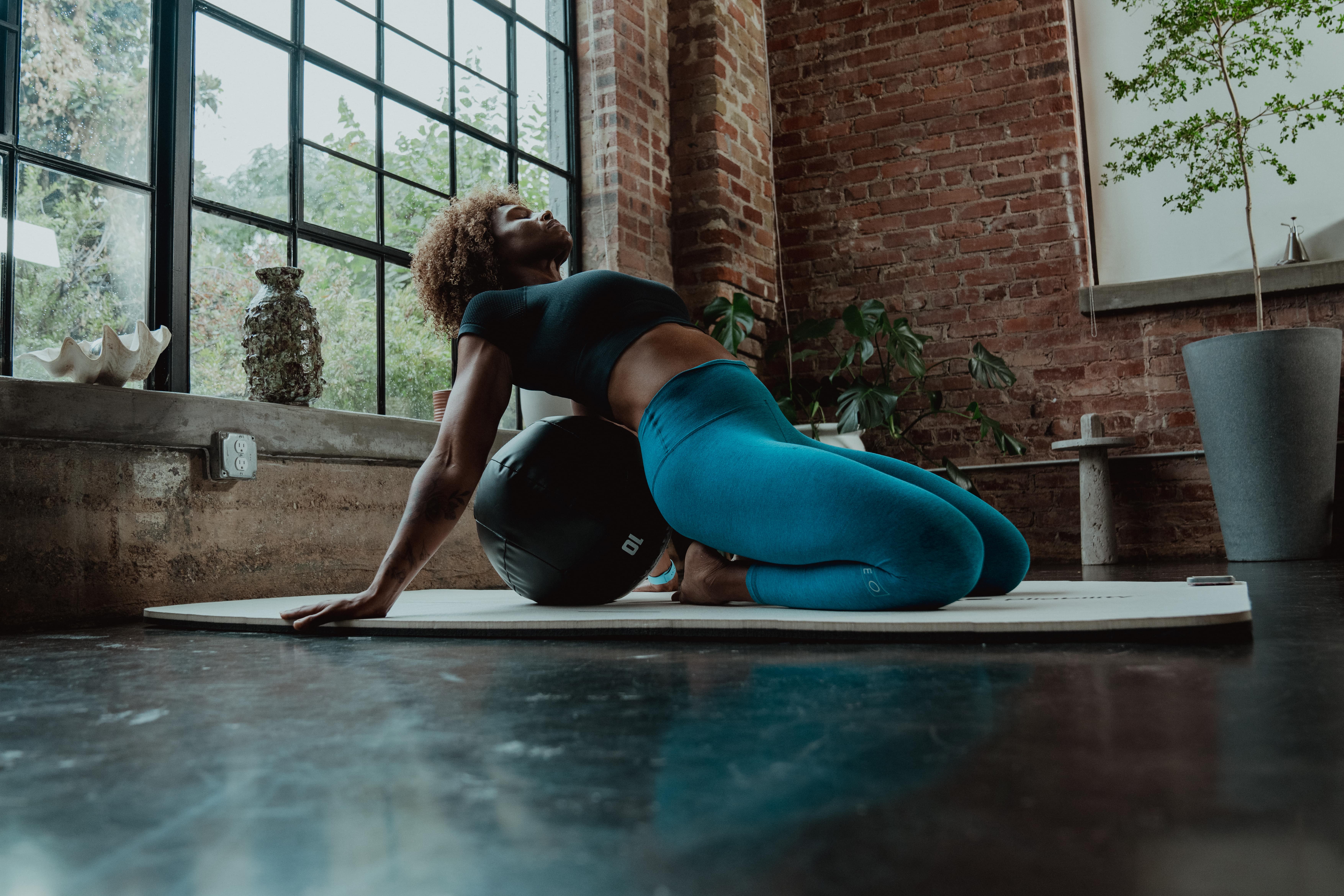 woman with a ball - Cervical Mobility Exercises