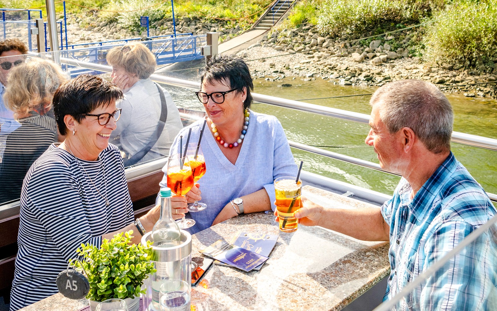 Koblenz cruise guests enjoying drinks on deck.