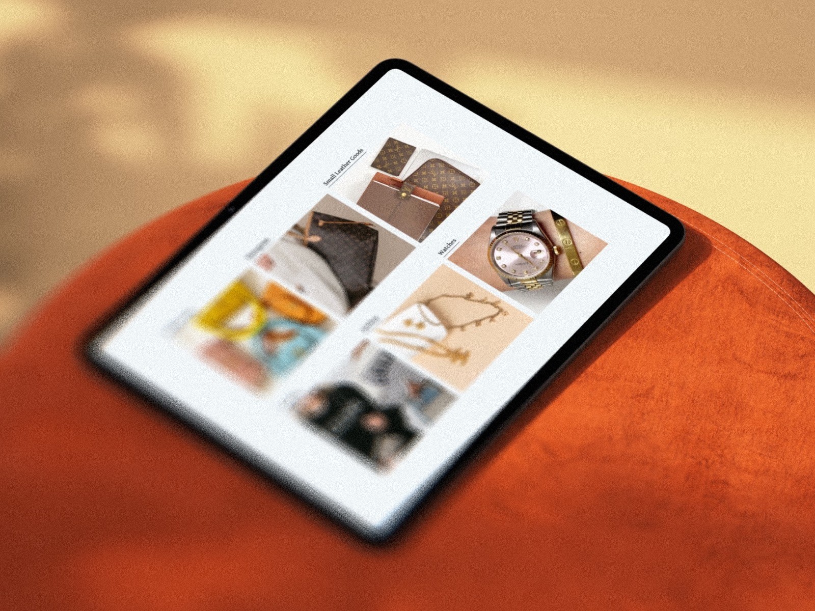 Three models standing in a wheat field, wearing beige suits.