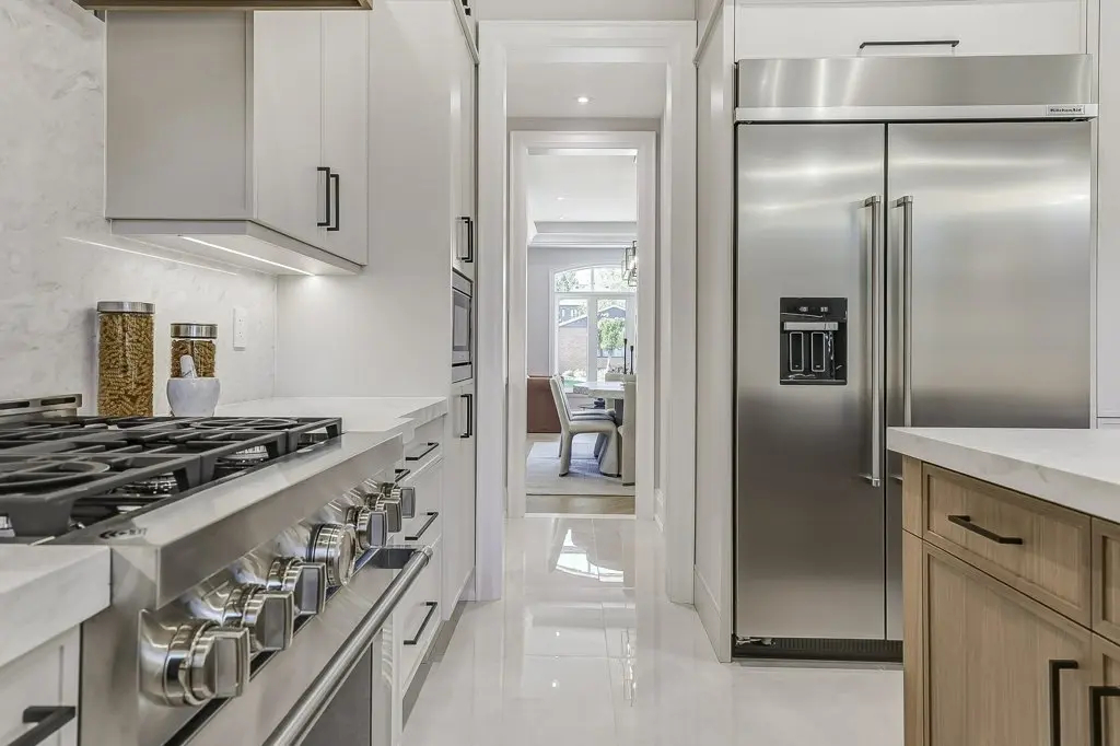 Kitchen photo of gas range and butler's pantry.
