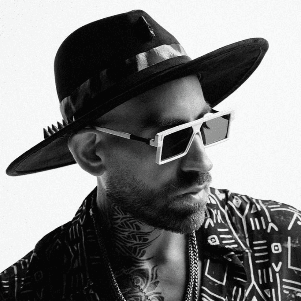 Black and white portrait of a man with a beard and glasses