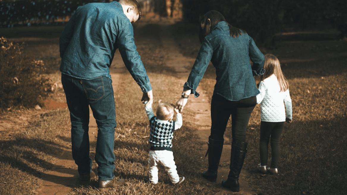 Family with yound children on a walk