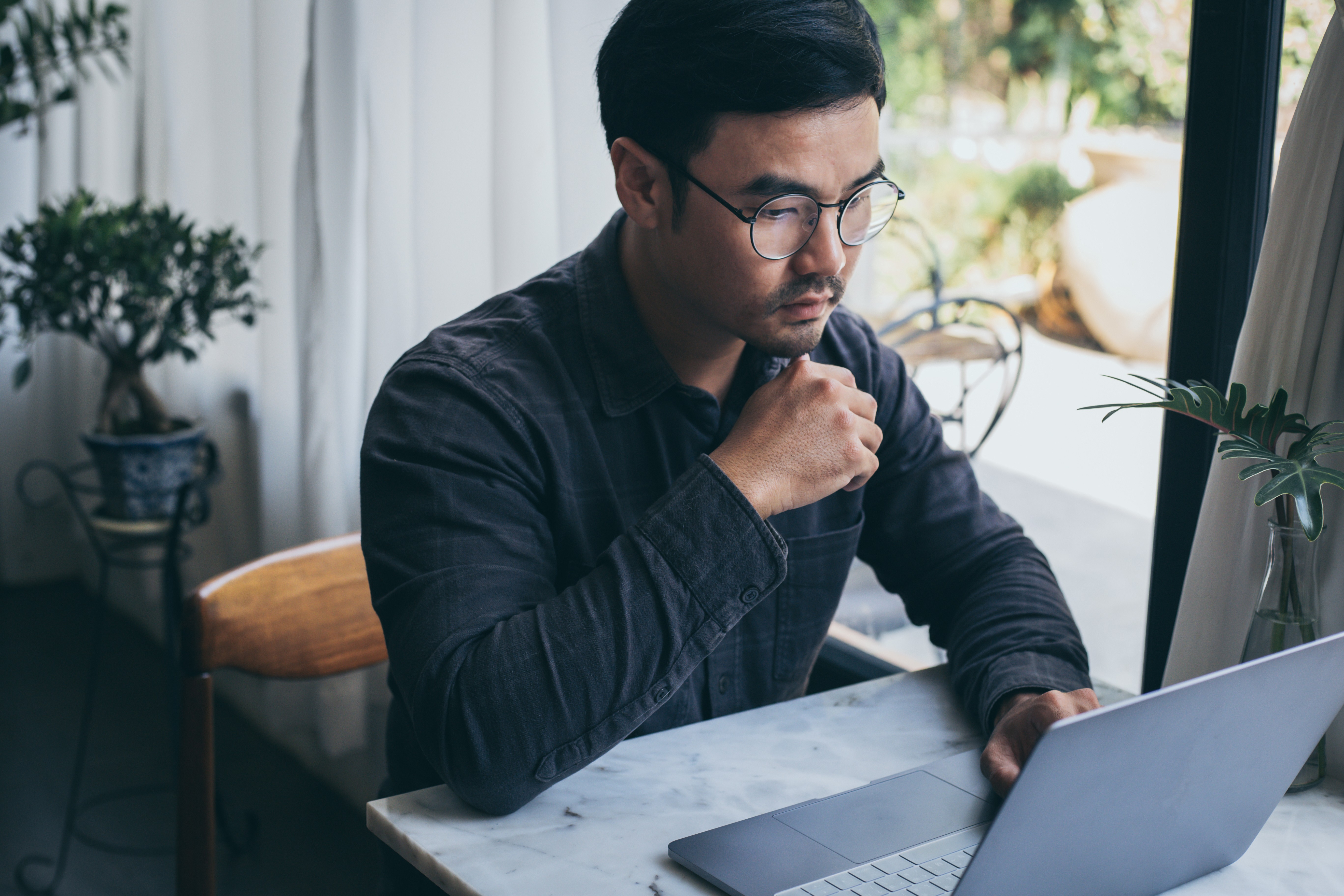 Professional studying training materials at a desk, representing structured training modules aligned with international standards and best practices.