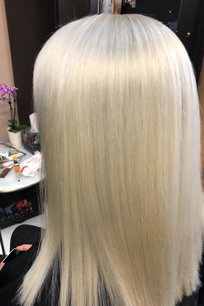 Long blonde hair transformation to cool platinum blonde
