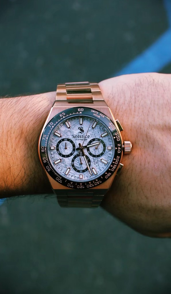 A meteorite dial watch on someone's wrist.