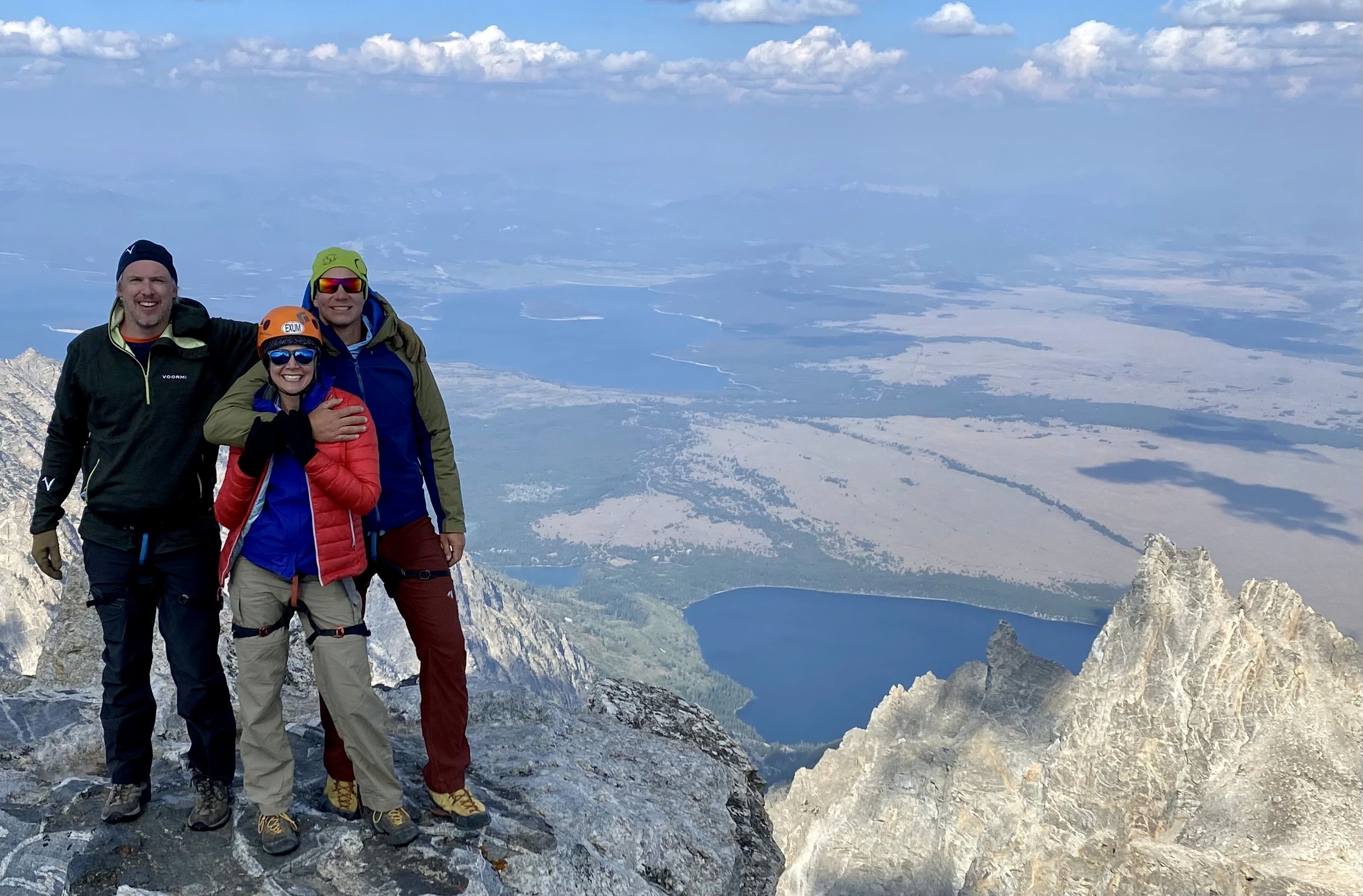 Matthew and Erin Lusins hiking with a client