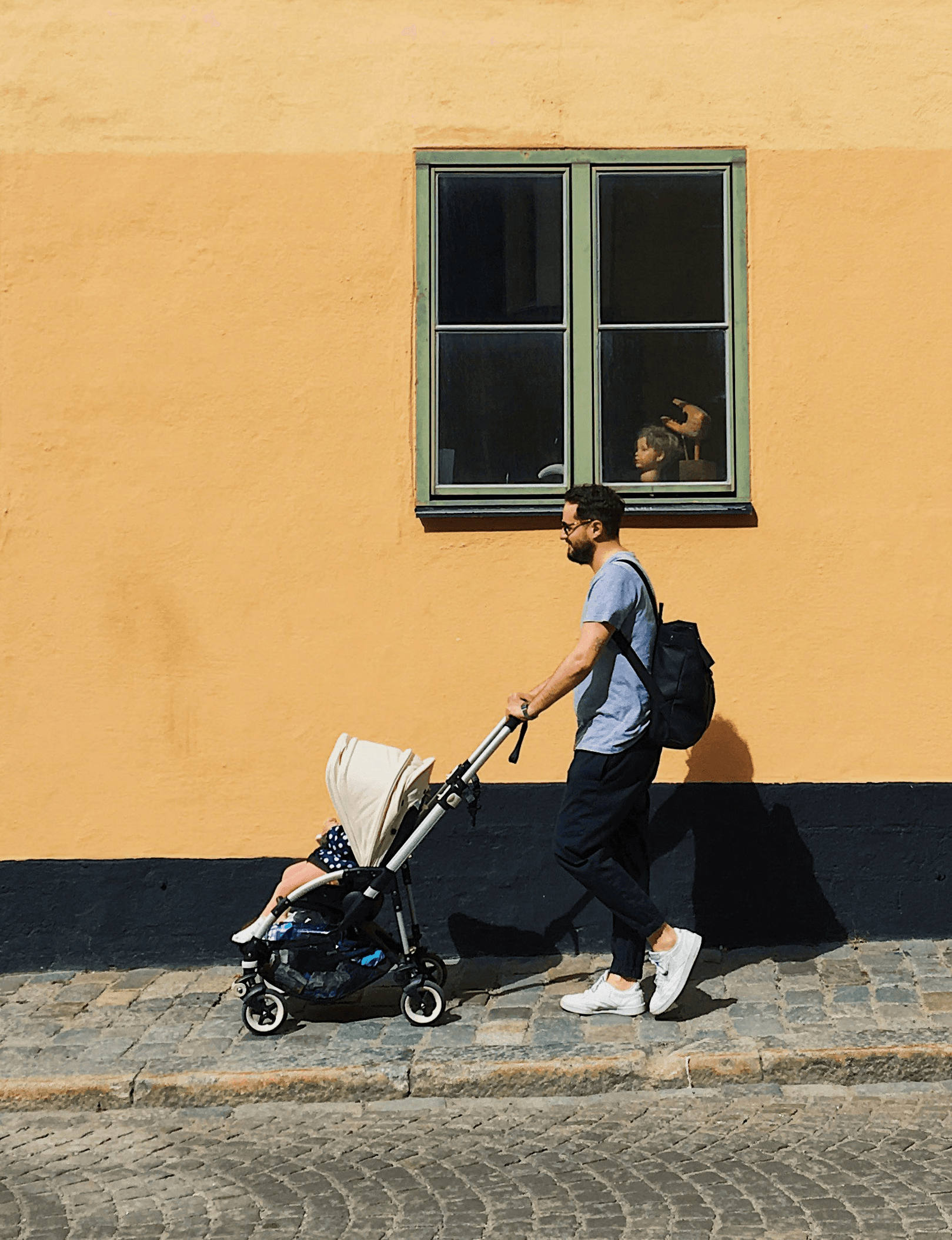 boy with a baby stroller