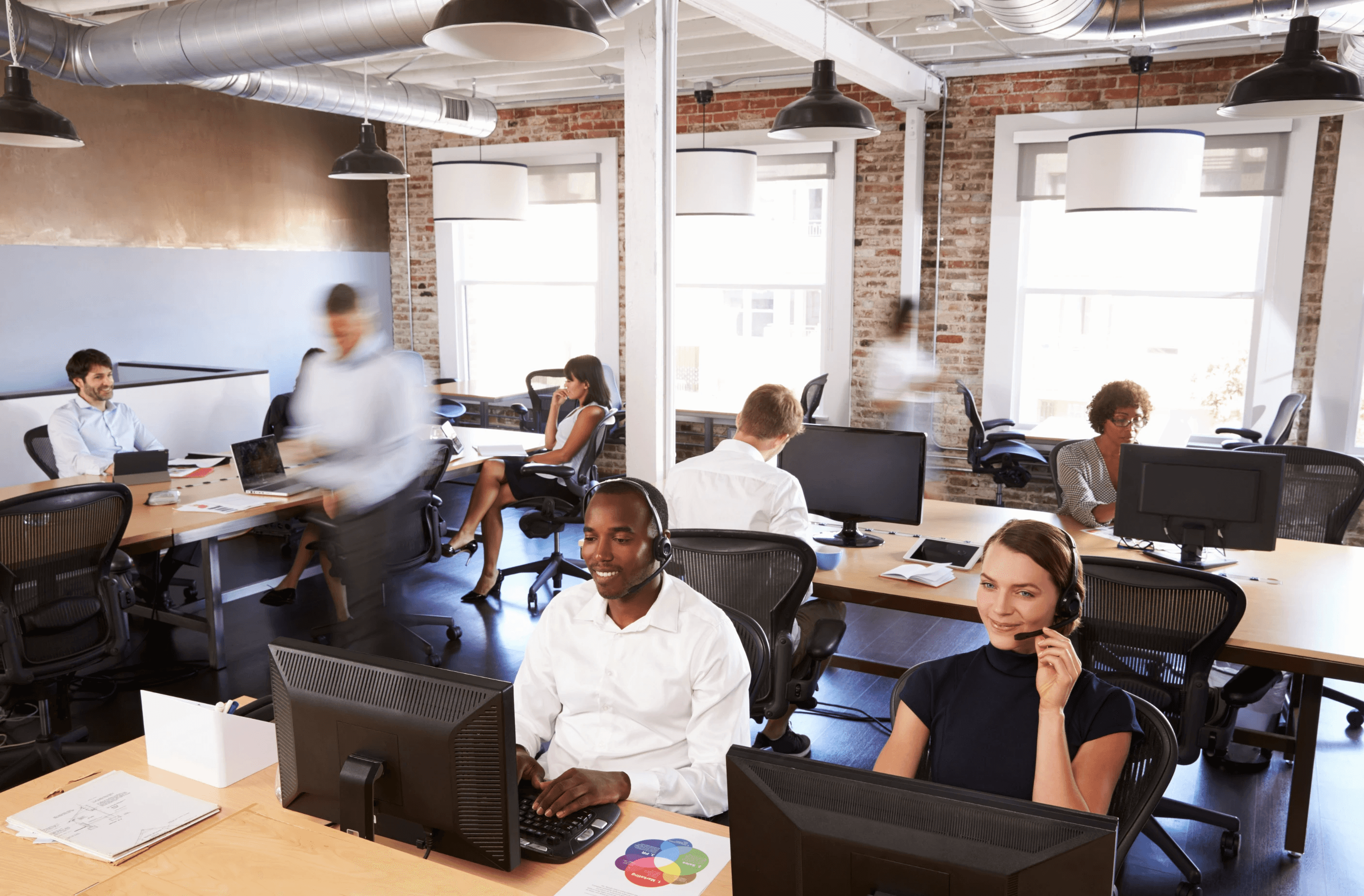 man sitting beside woman looking at a contract on DocuSign
