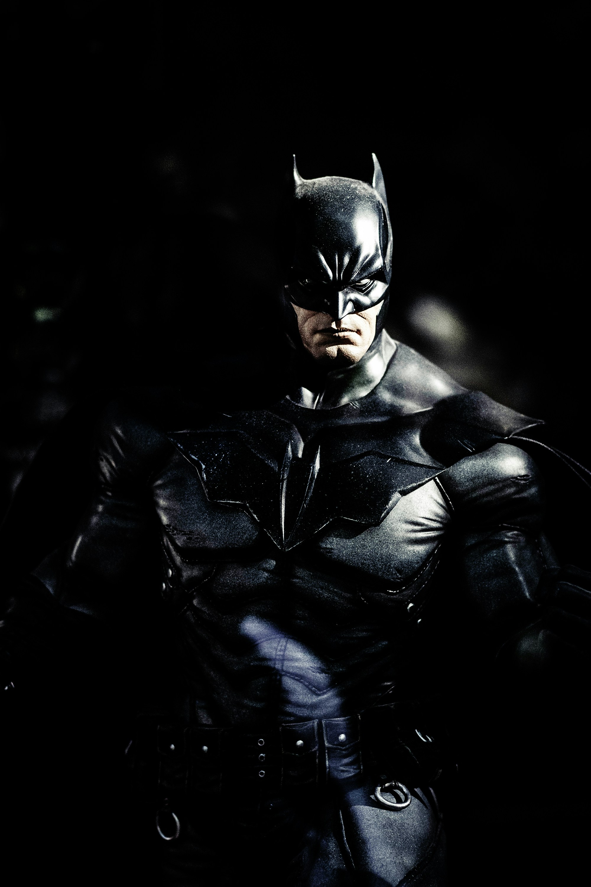 A photo image of Batman against a dark background