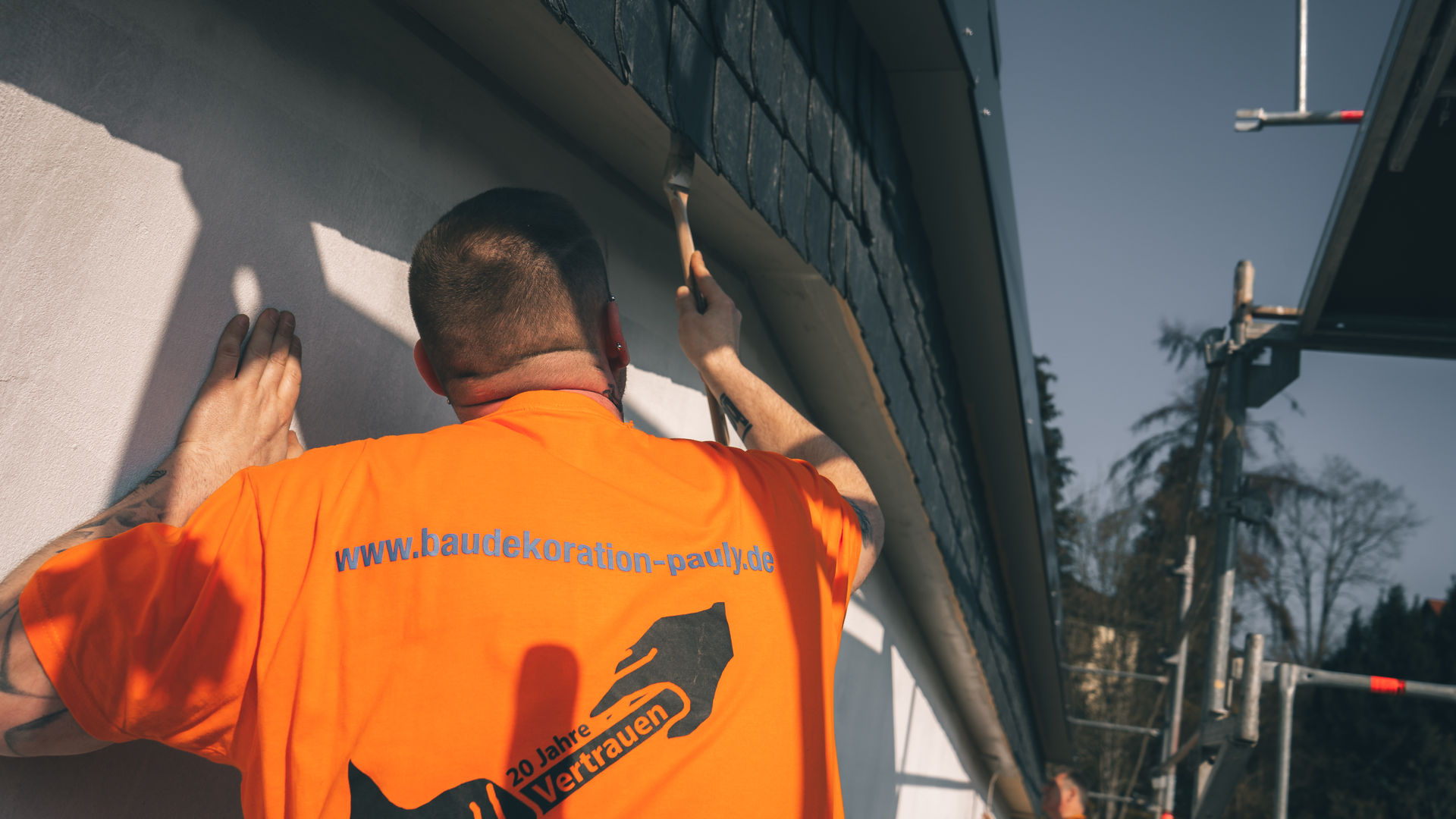 woman sitting around table holding tablet