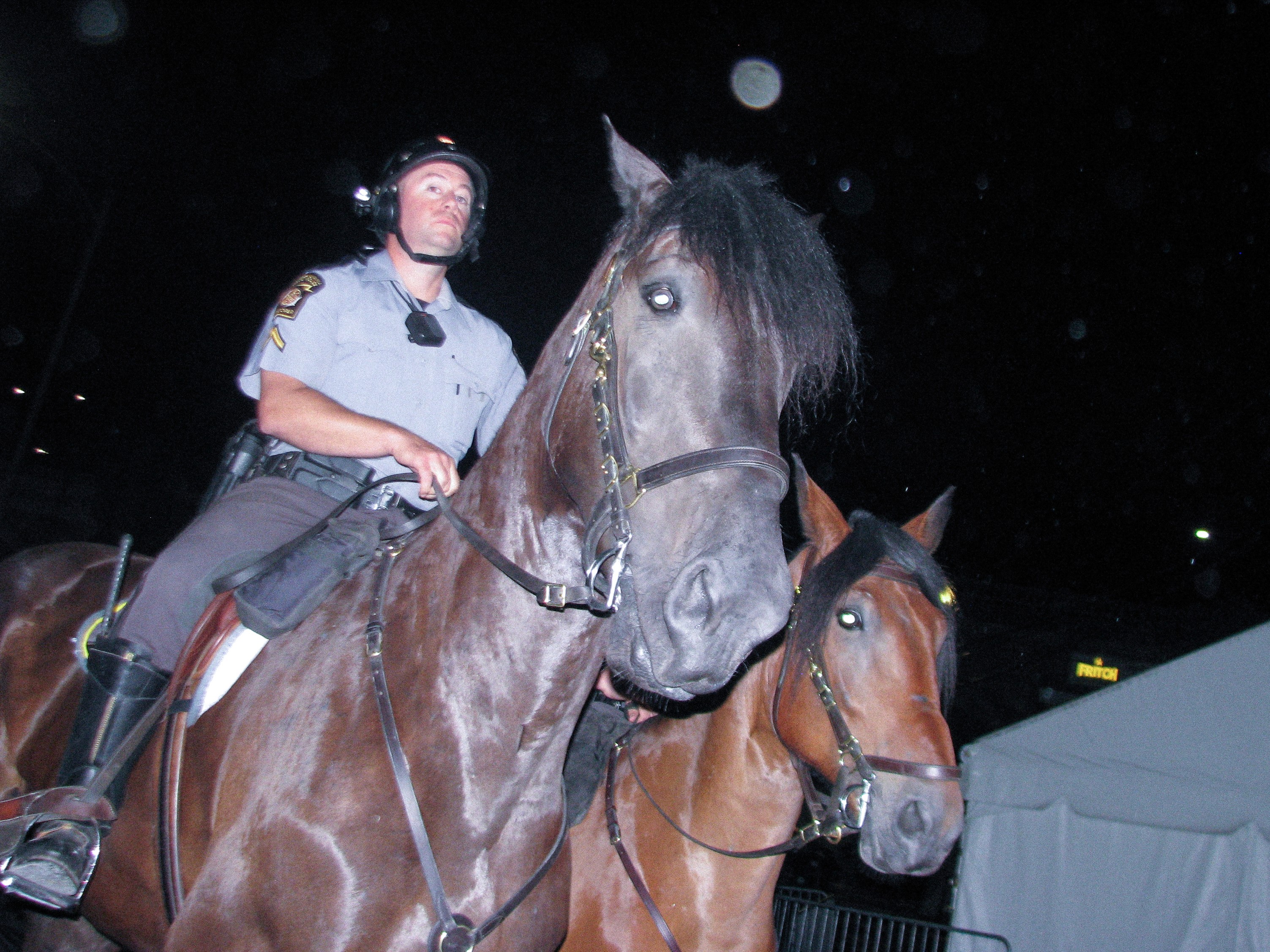 AN UNHAPPY OFFICER AT MUSIKFEST, PREPARING TO DISPLACE FESTIVAL GOERS. CANON POWERSHOT. FALL 2025. BETHLEHEM, PA.