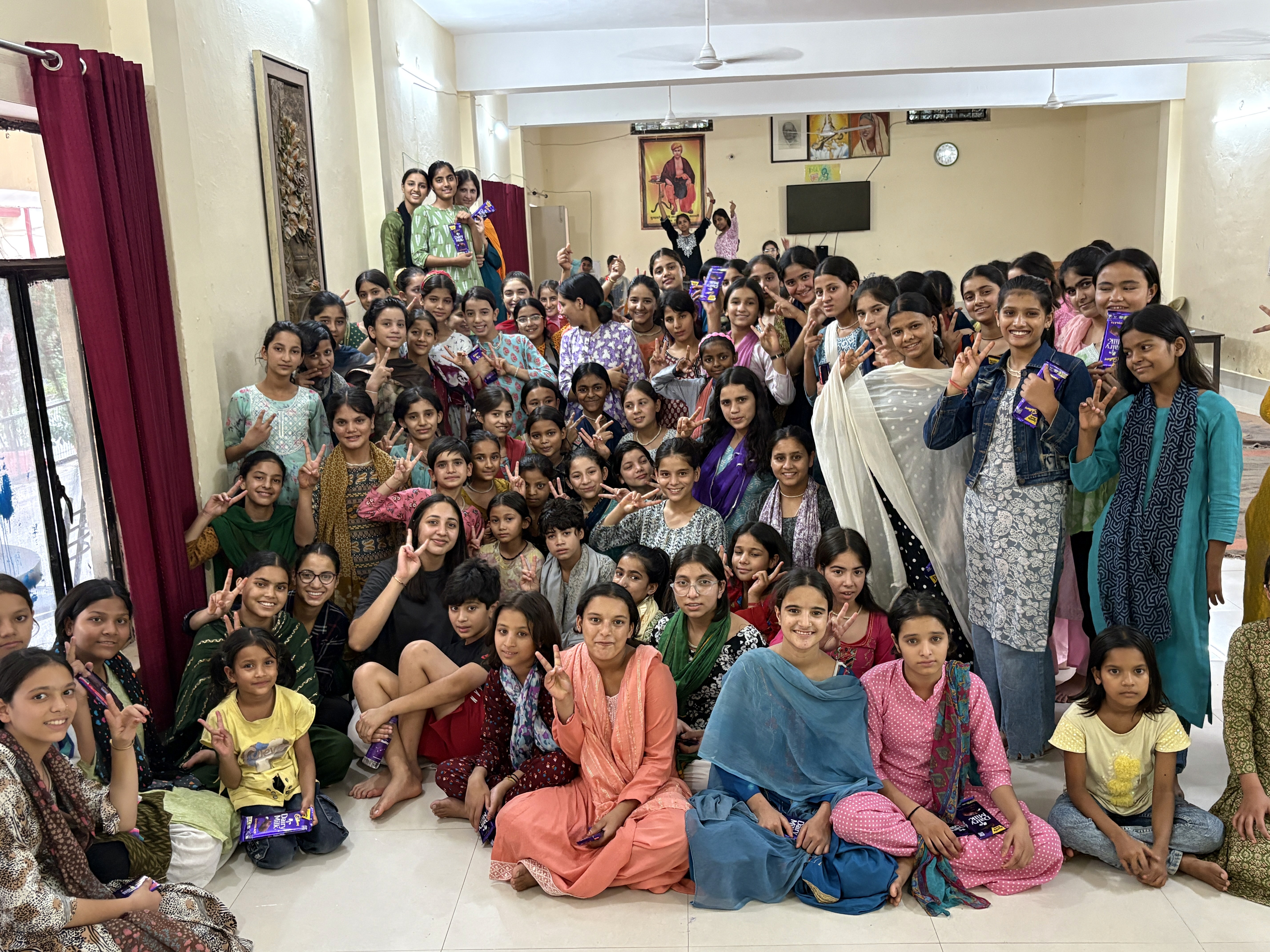 kids lying on a glass land and smiling