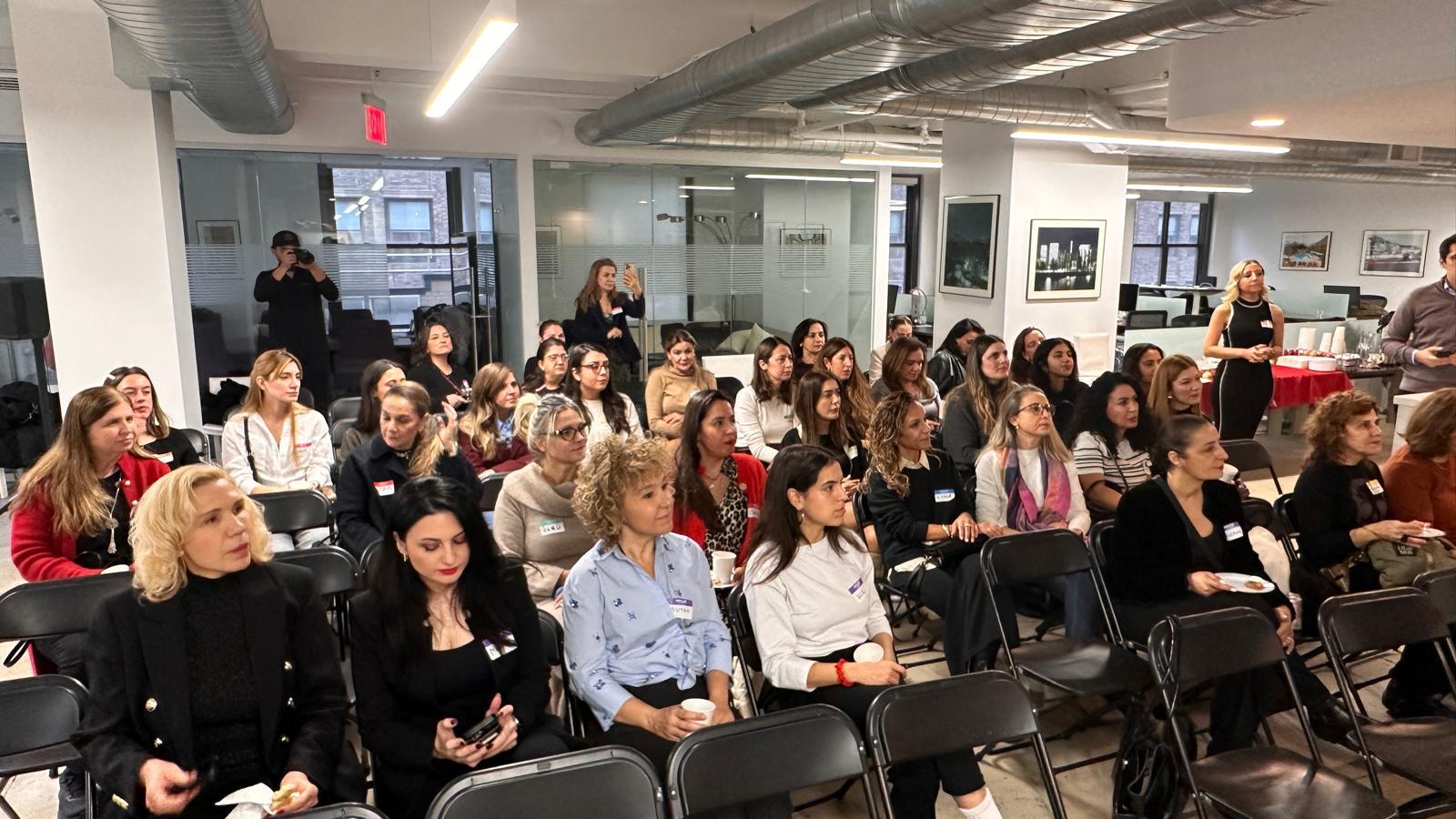 4 women standing on beach during daytime