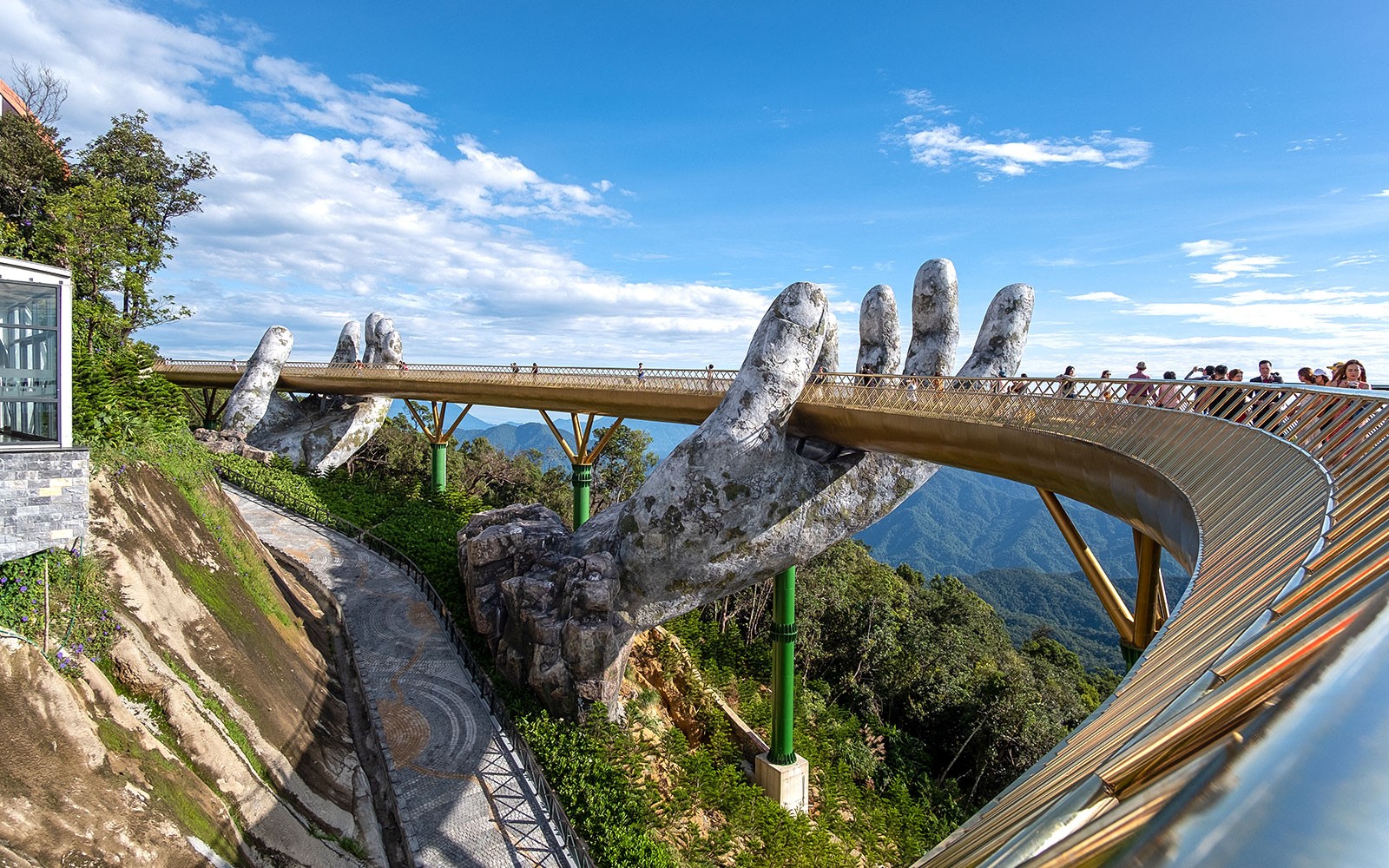 Golden Bridge held by giant hands at Sun World Ba Na Hills, Vietnam.