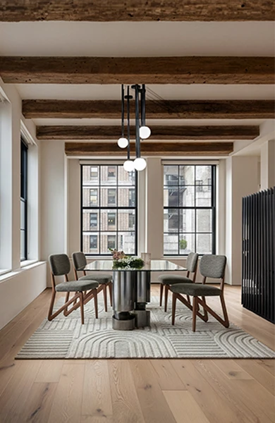 luxury dining room with glass table and artistic legs