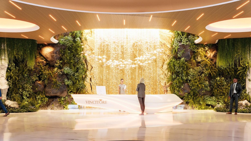Lobby of Vincitore Wellness Estate featuring a central arrangement of vibrant plants and flowers.