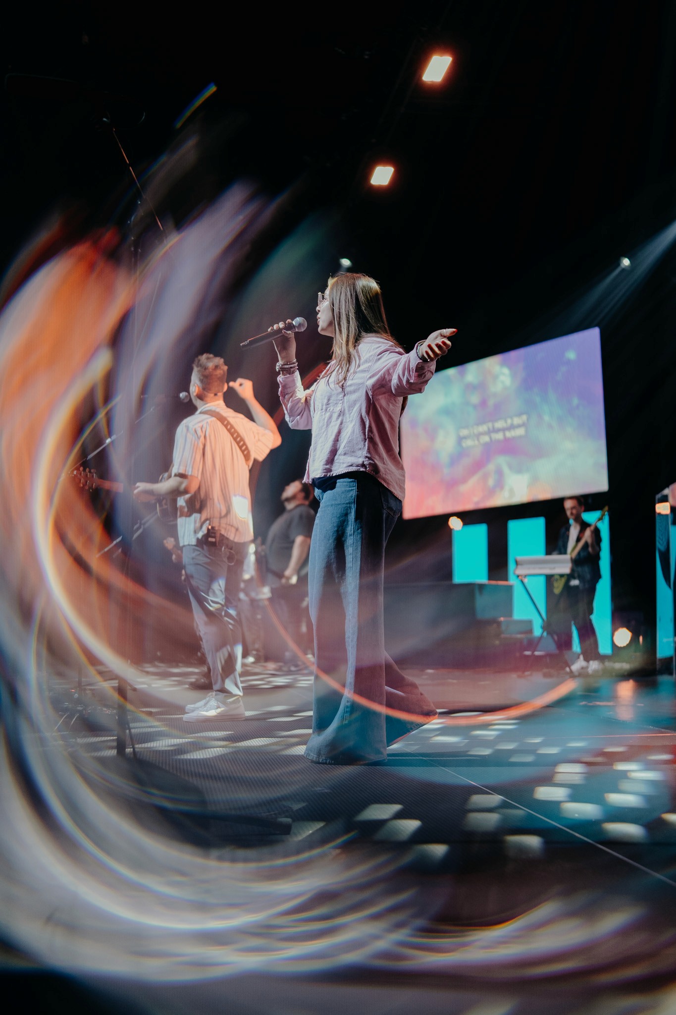 two people looking at a tablet and smiling
