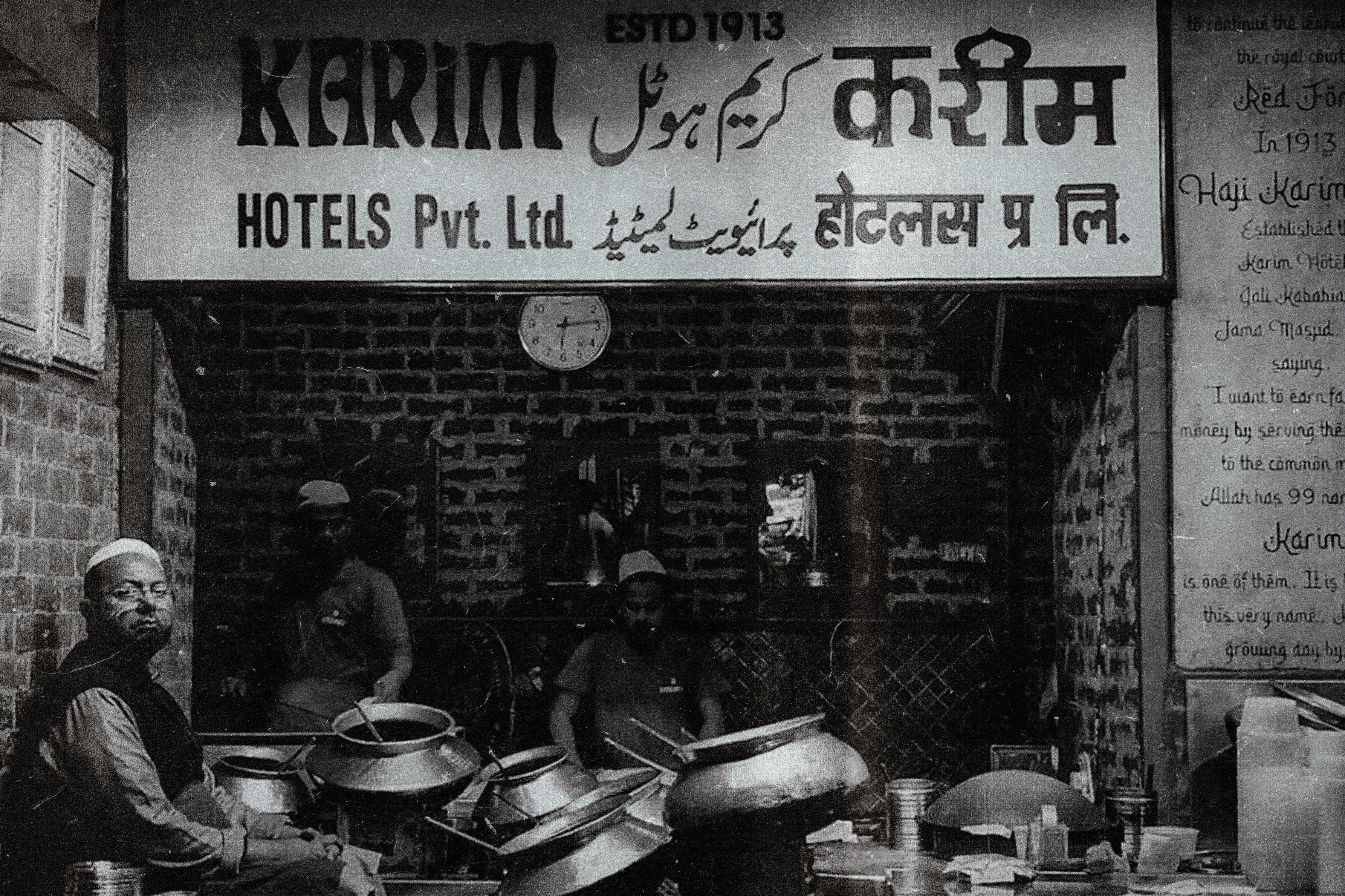 Chef plating a fried chicken sandwich