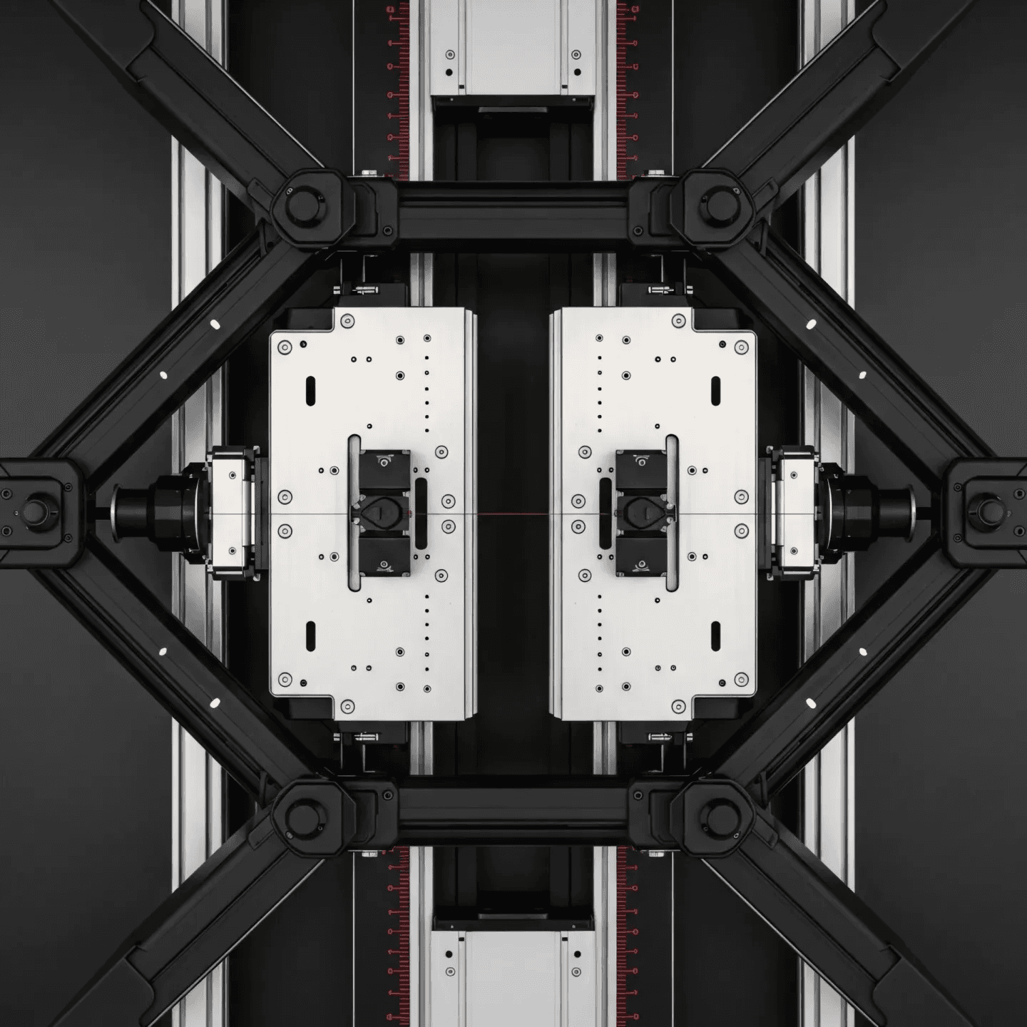 Top down view of industrial fixture with symmetrical clamps