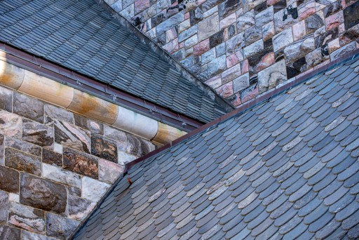 Restored historic roof on a Midtown Tulsa home with copper flashing and slate shingles