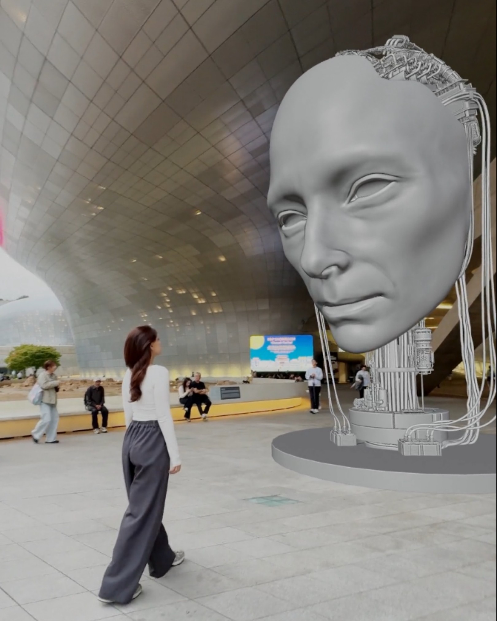 Gray-scale 3D wireframe models showing the mechanical structure of a giant robotic head