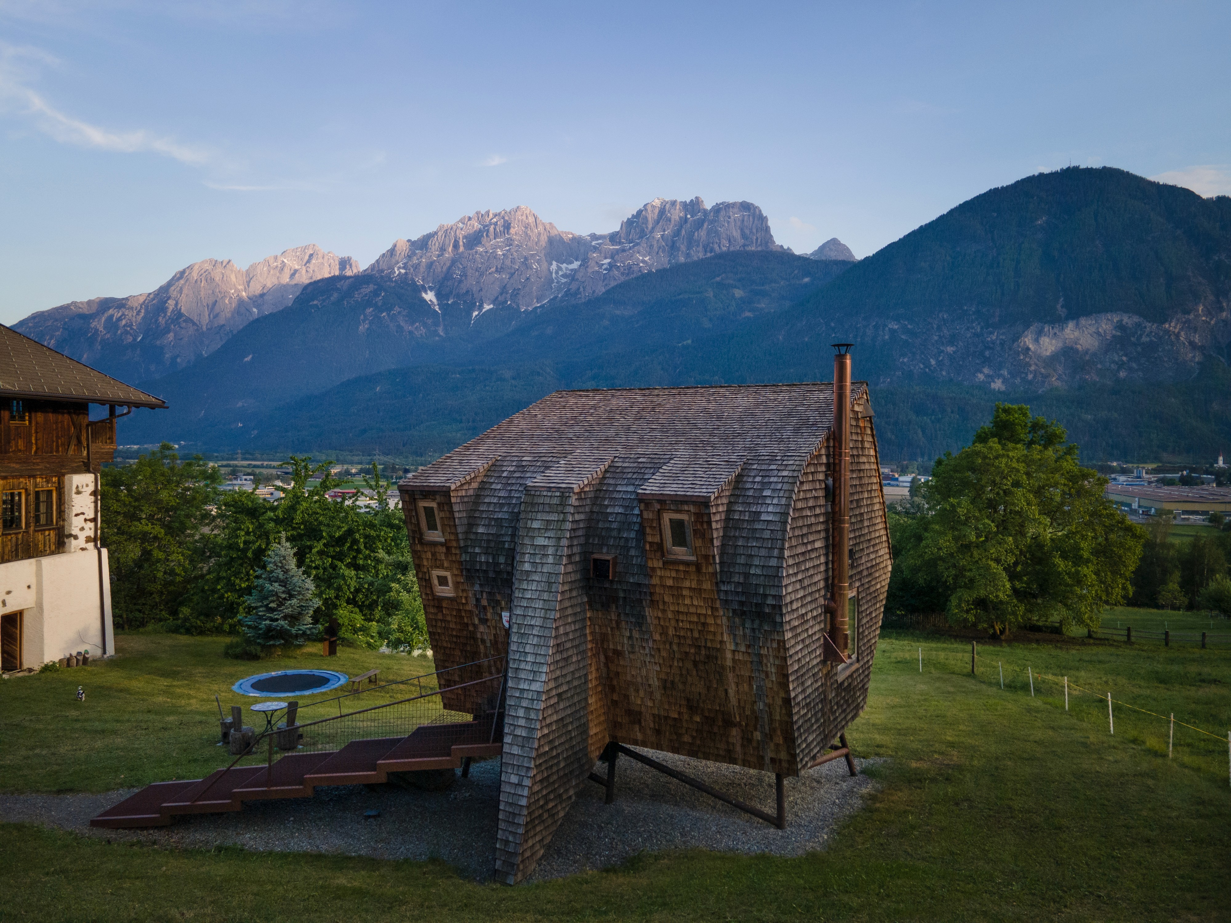 Ufogel’s elevated timber hideaway set against the mountain panorama of the Lienz Dolomites in Austria
