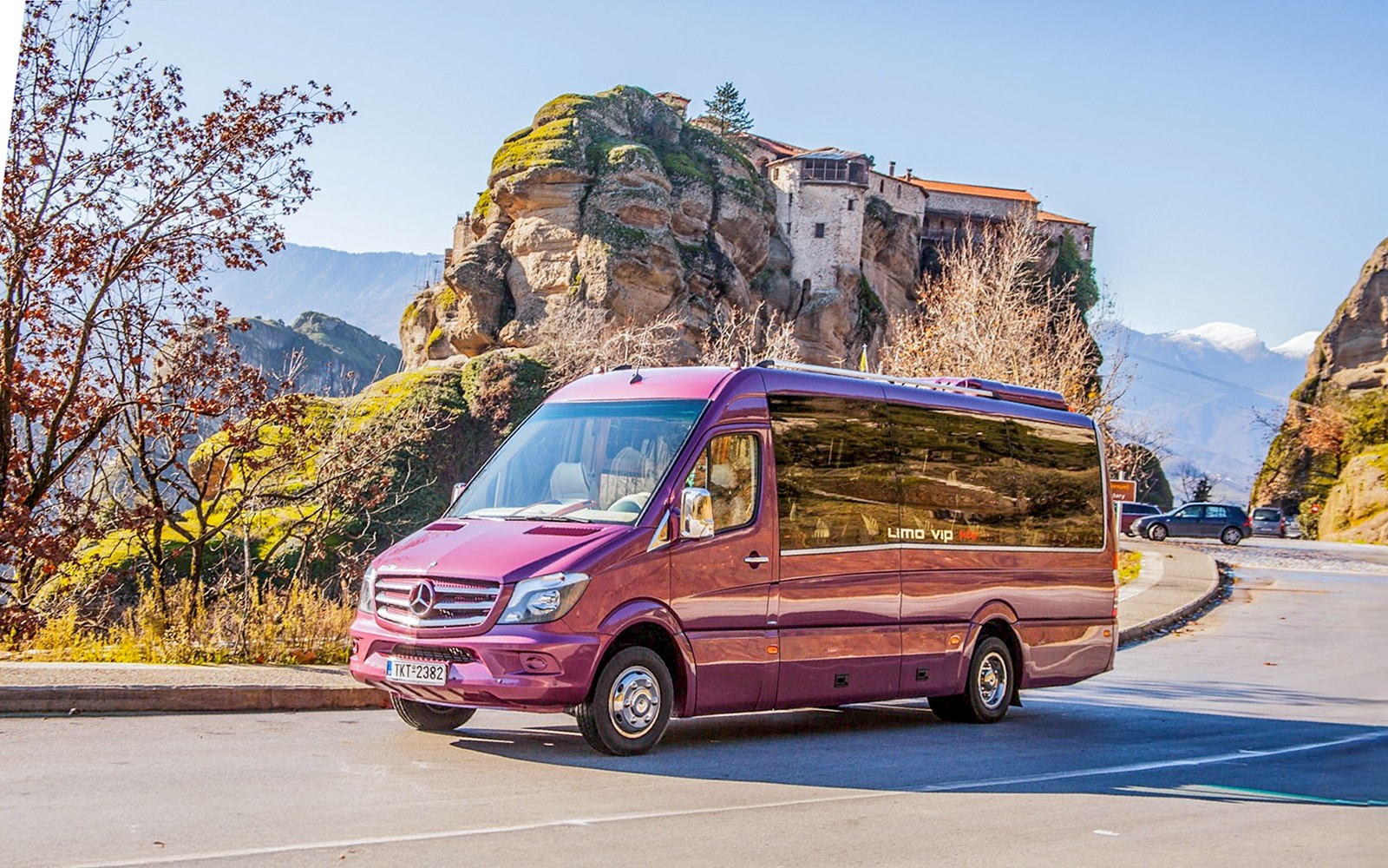 Tour bus in front of Meteora Monasteries, Greece, during a guided day trip from Athens.