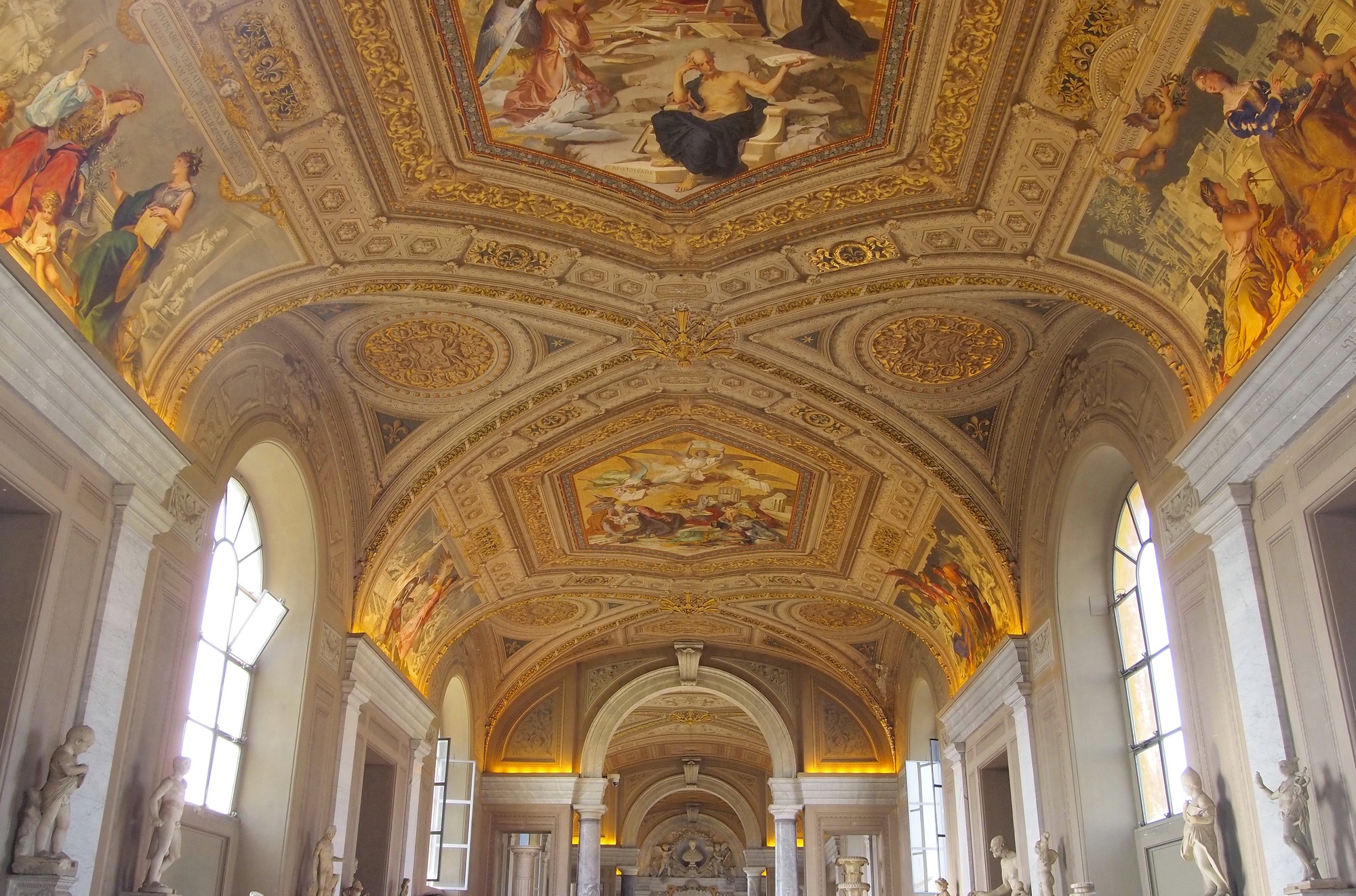 A wooden walkway leading to a body of water
